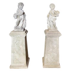 Pair of Stone Garden Sculptures Angels on Bases with Flowers and Fruit