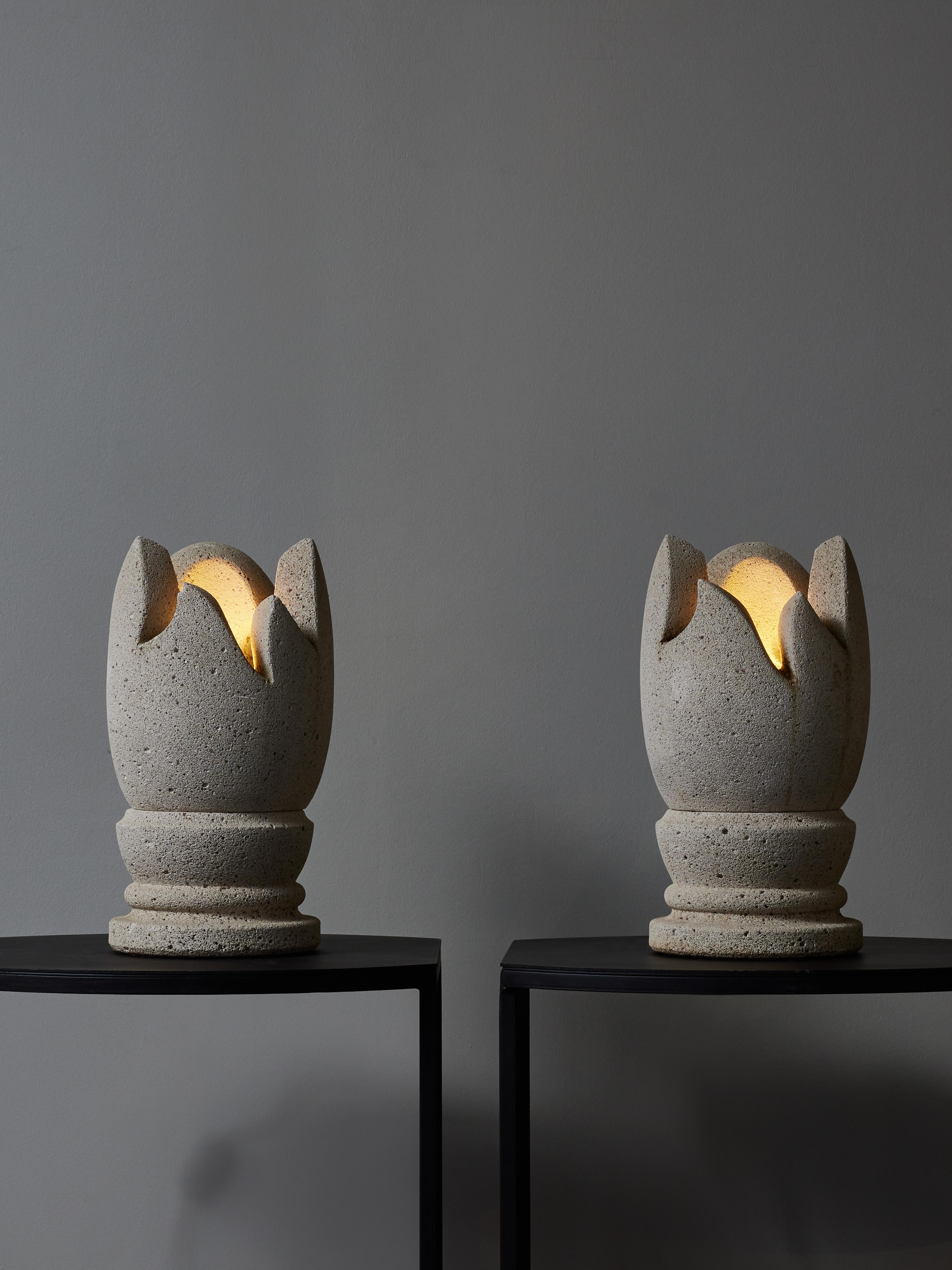 Pair of small and unusual pair of table lamps shaped like a flame, made of stone.