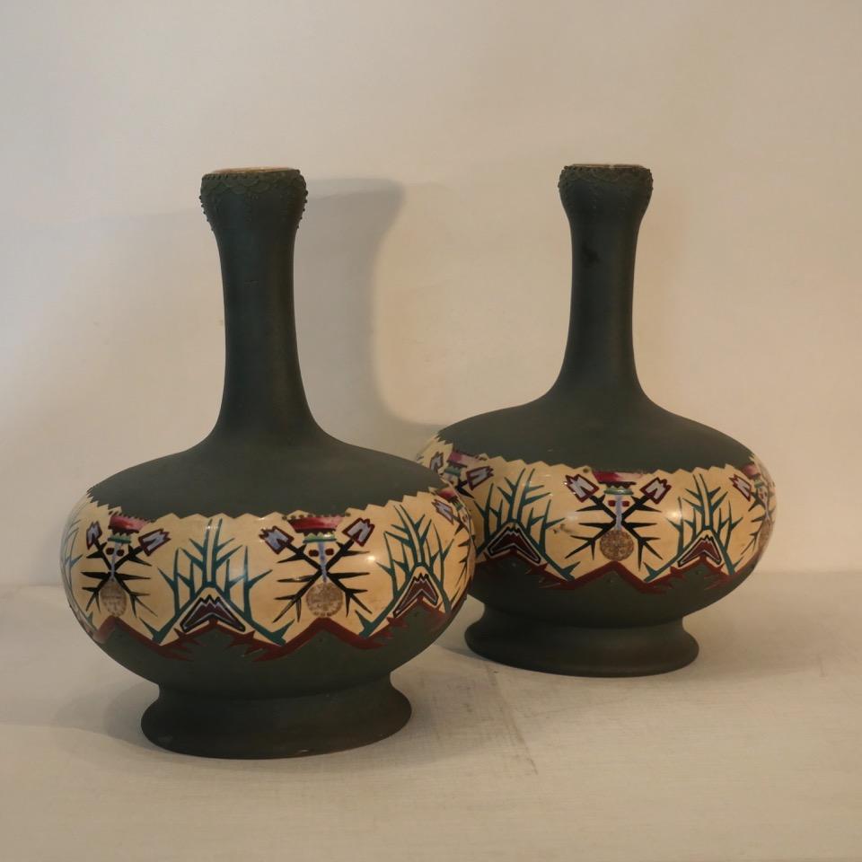 Pair of stoneware vases, baluster-shaped, decorated with a frieze of stylized floral motifs, Germany,
circa 1930.