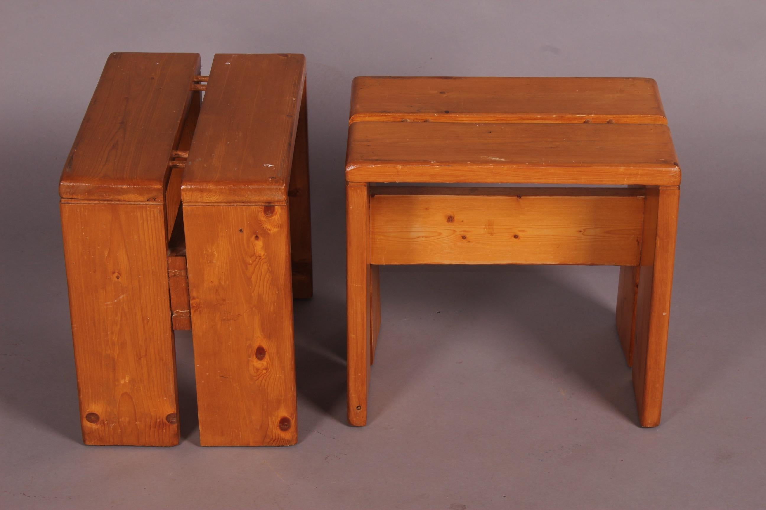 Pair of stools by Charlotte Perriand for Les Arcs, small repair. See on photo.