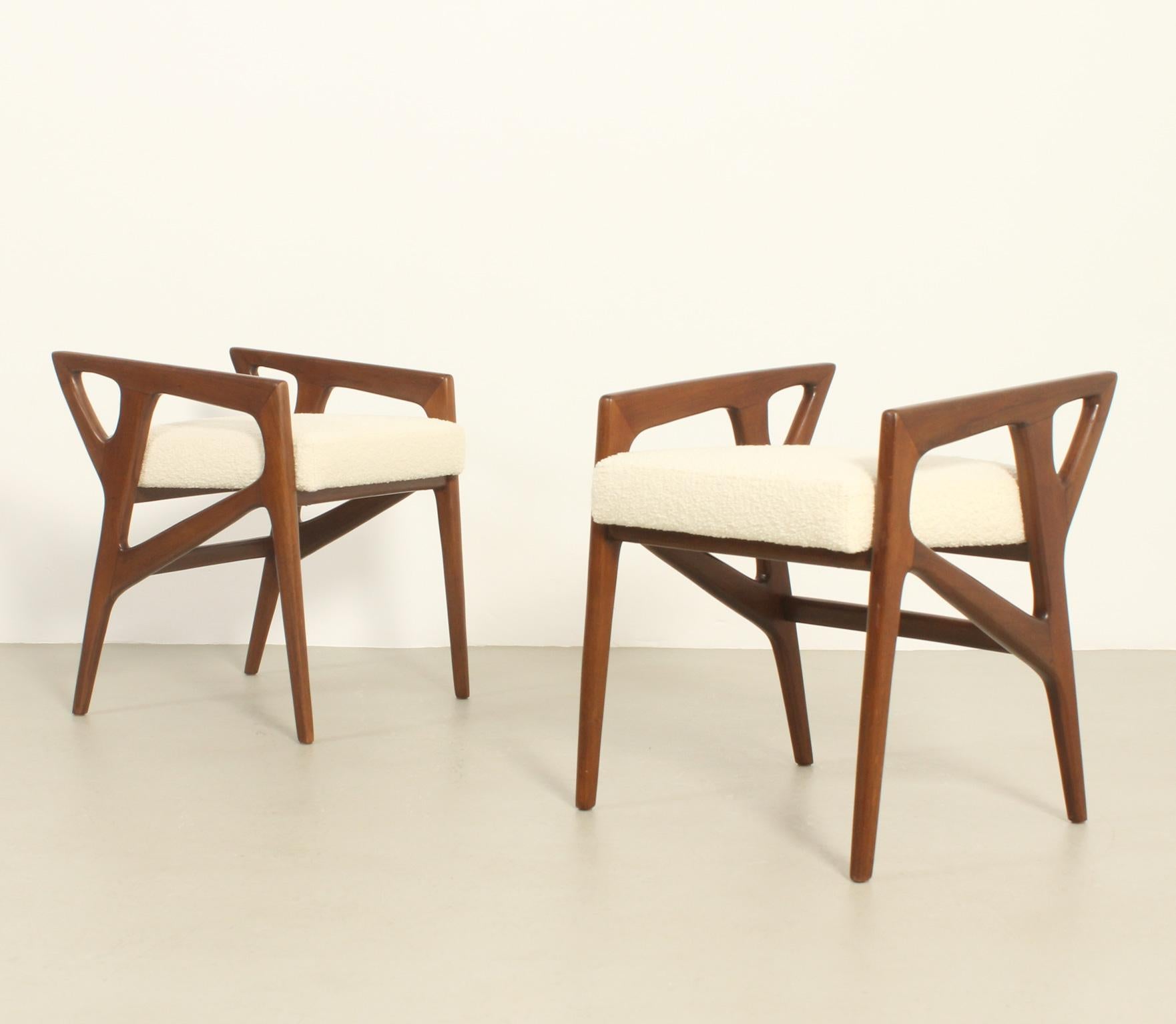 Pair of stools model 687 designed in 1953 by Gio Ponti for Cassina, Italy. Walnut wood structure and upholstered with new boucle fabric by Bisson Bruneel. 