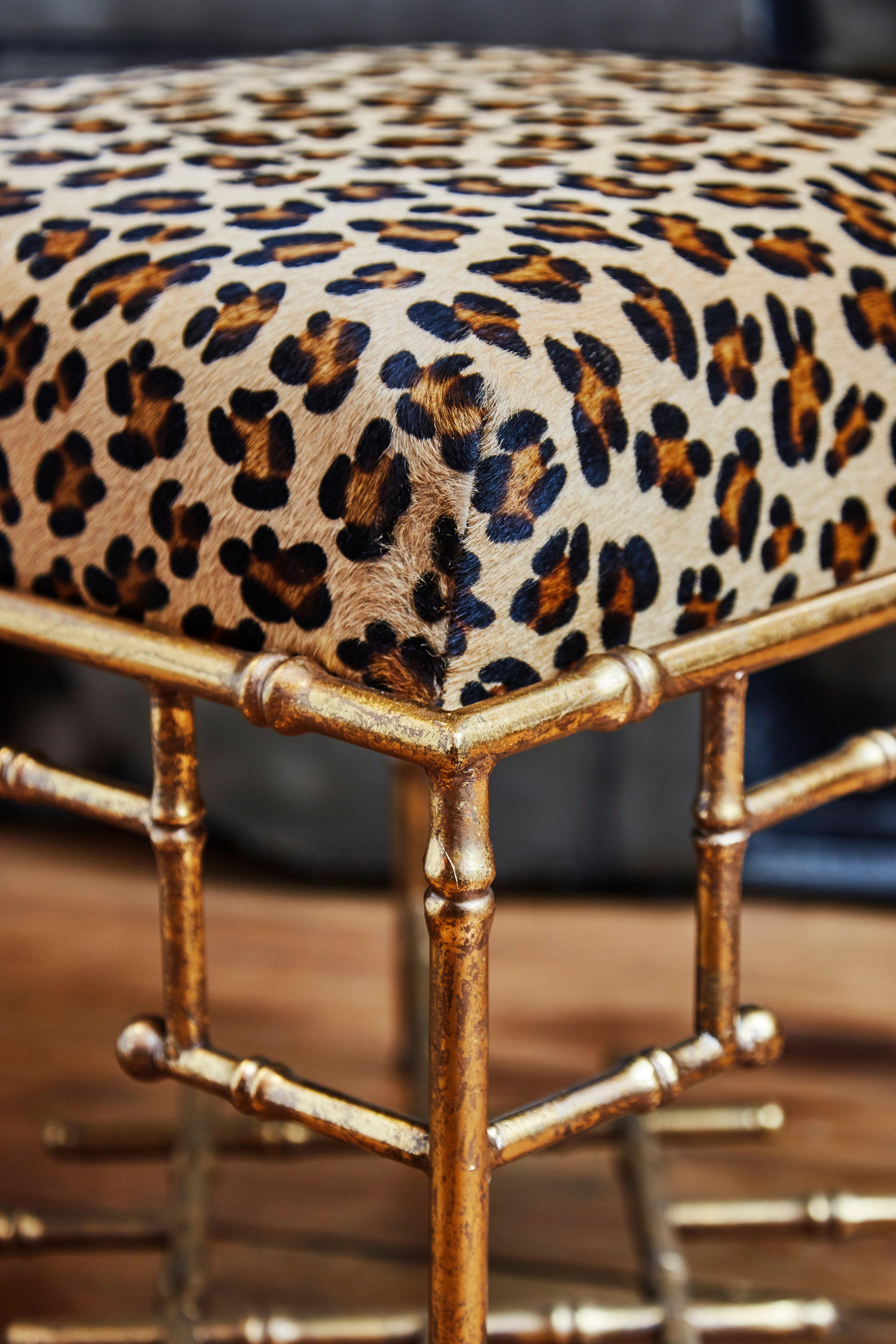Pair of stools upholstered with foal fur - bamboo style legs.