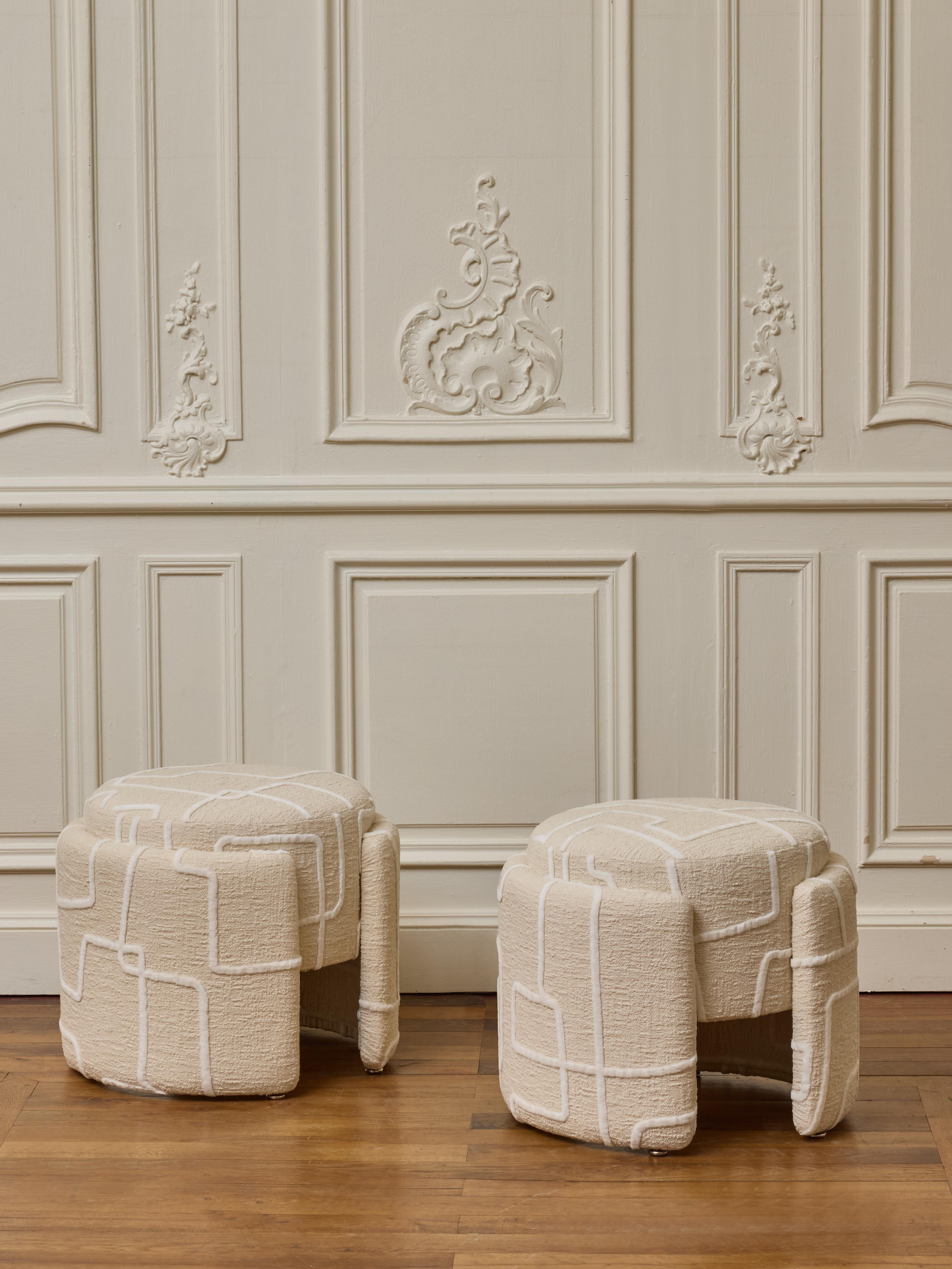 Pair of stools entirely upholstered with a fabric by Dédar.
France, 2024.

Dimensions: Diam 48 x H 38 cm