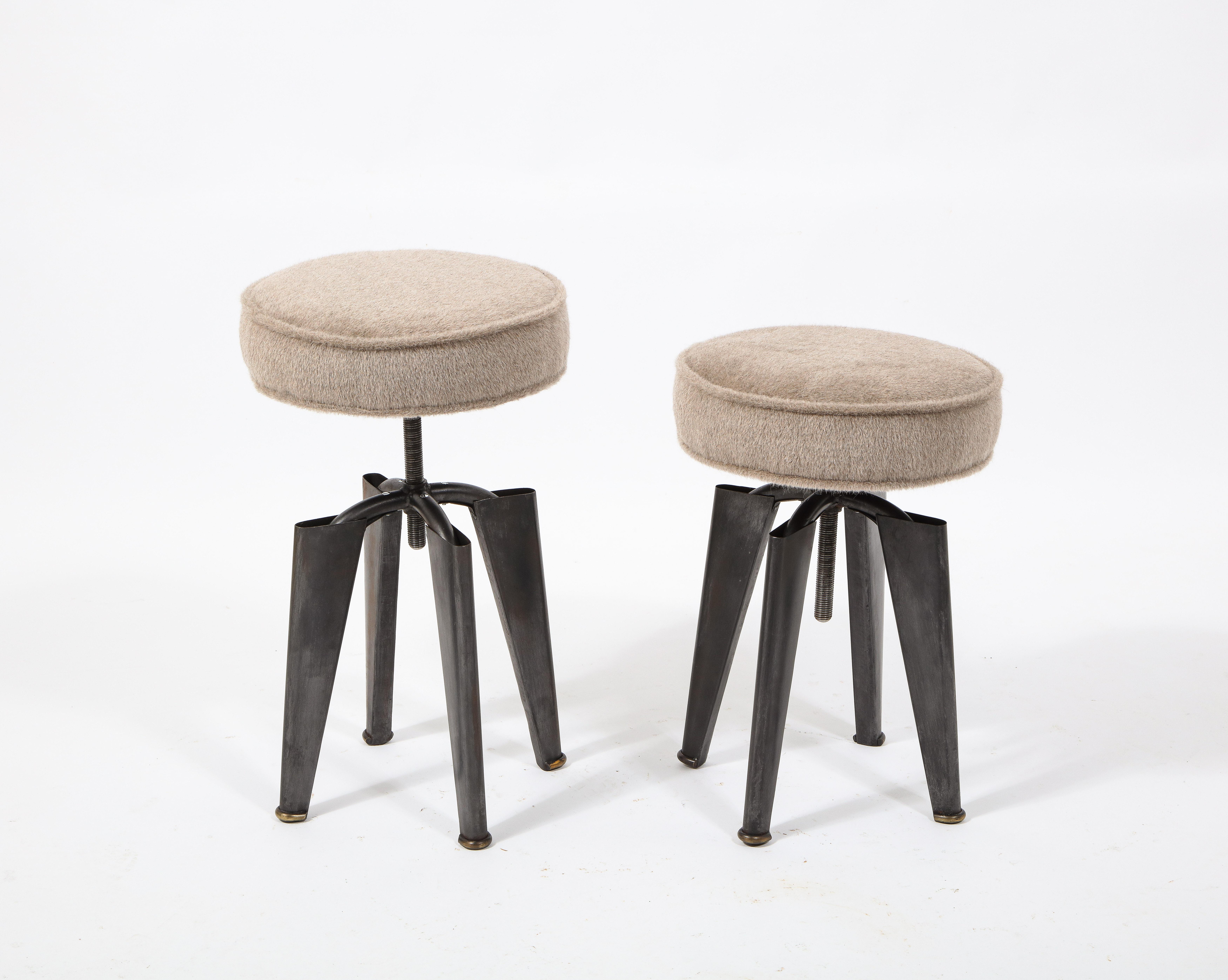 Pair of stools for the Clemenceau French warship designed by Dominique, found throughout the ship in officer quarters, manufactured with the same processes used in Prouvé furniture, pressed and folded steel with a long adjustable stem, freshly
