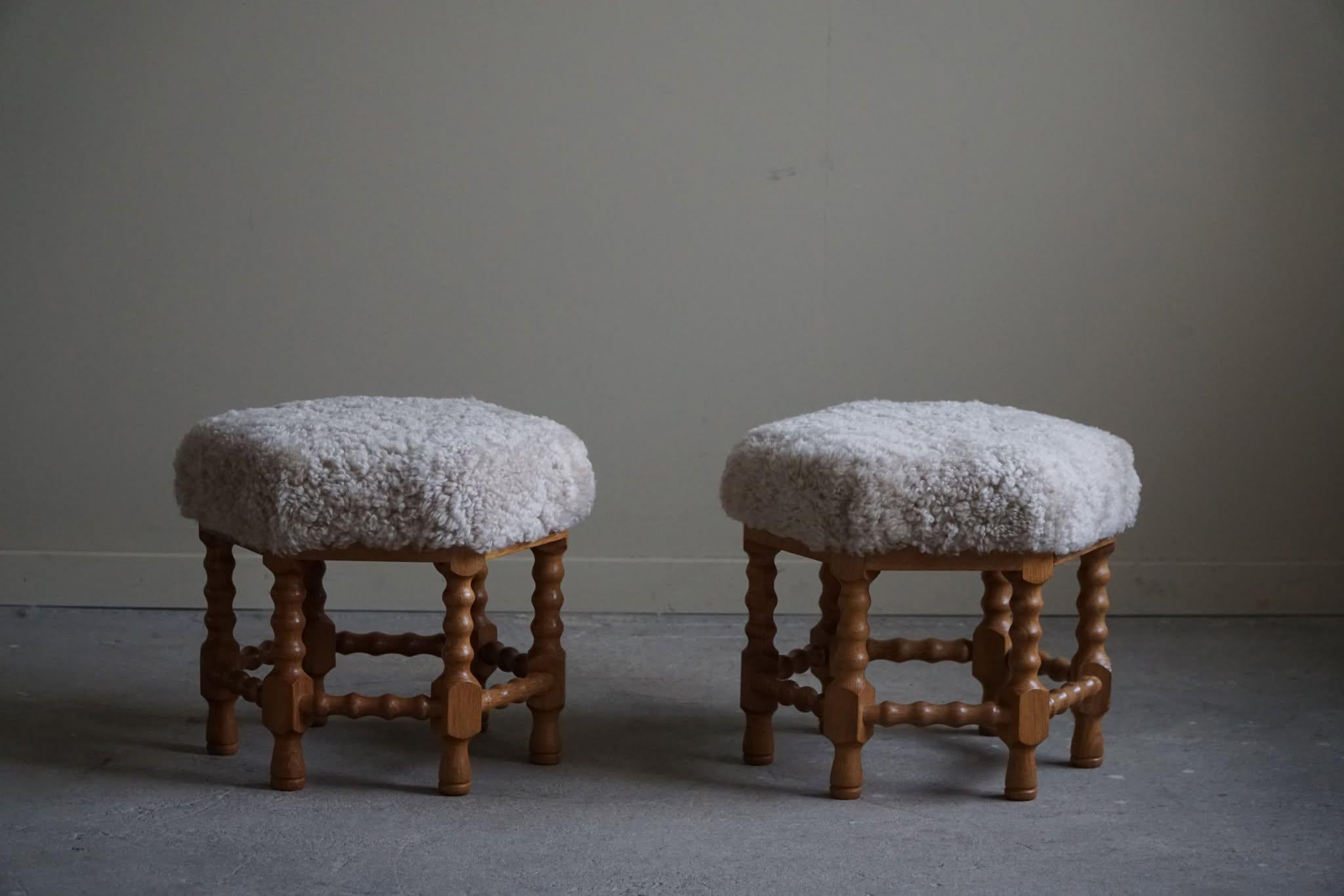 A pair of Danish modern stools in oak with curly legs, hexagon seats reupholstered great quality lambswool. Made by a Danish Cabinetmaker in the 1950s. A rare pair with an intriguing impression. 

A great object for the Scandinavian, Classic or