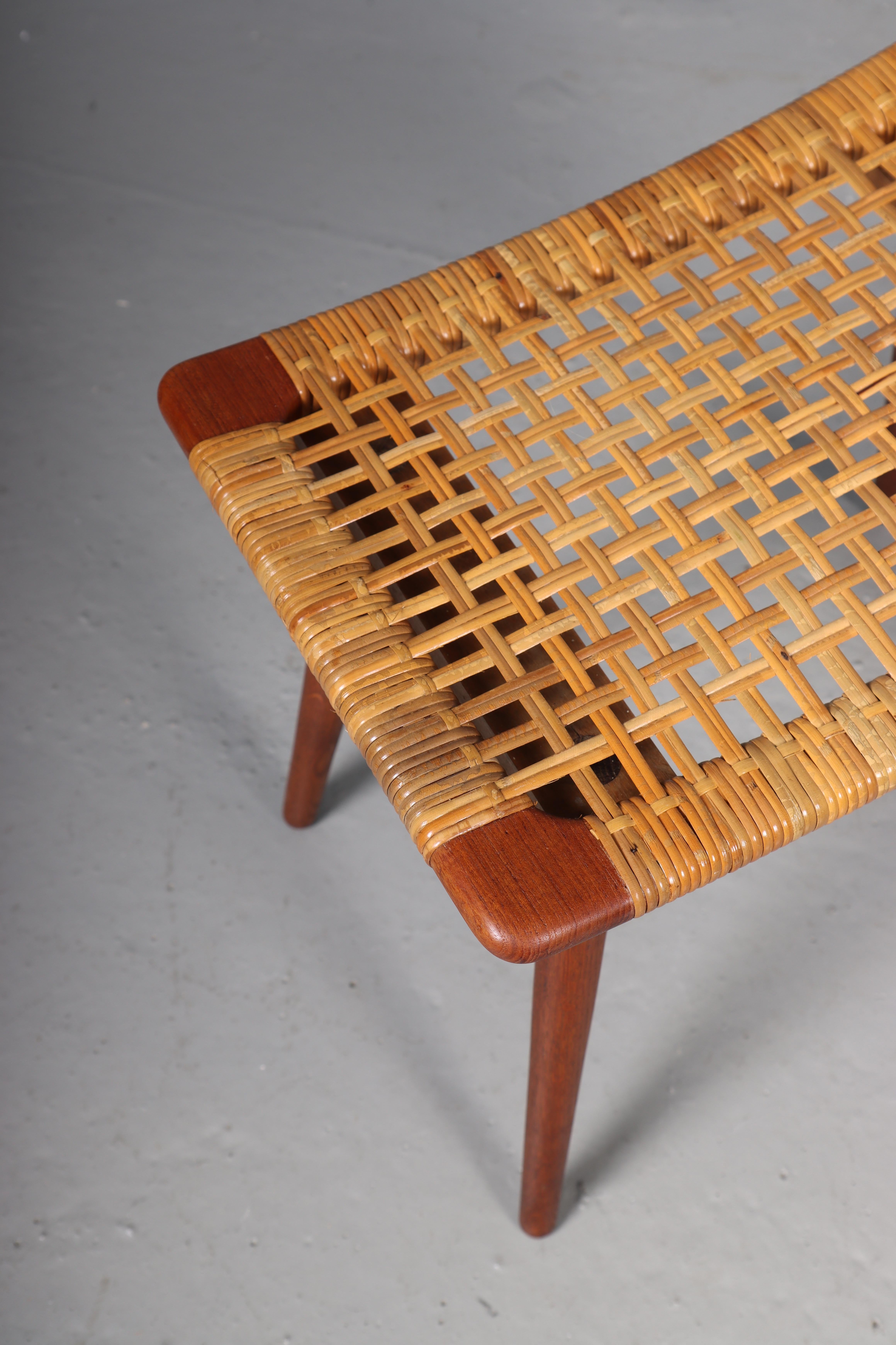 Pair of stools in teak and cane, designed and made in Denmark. Great original condition.