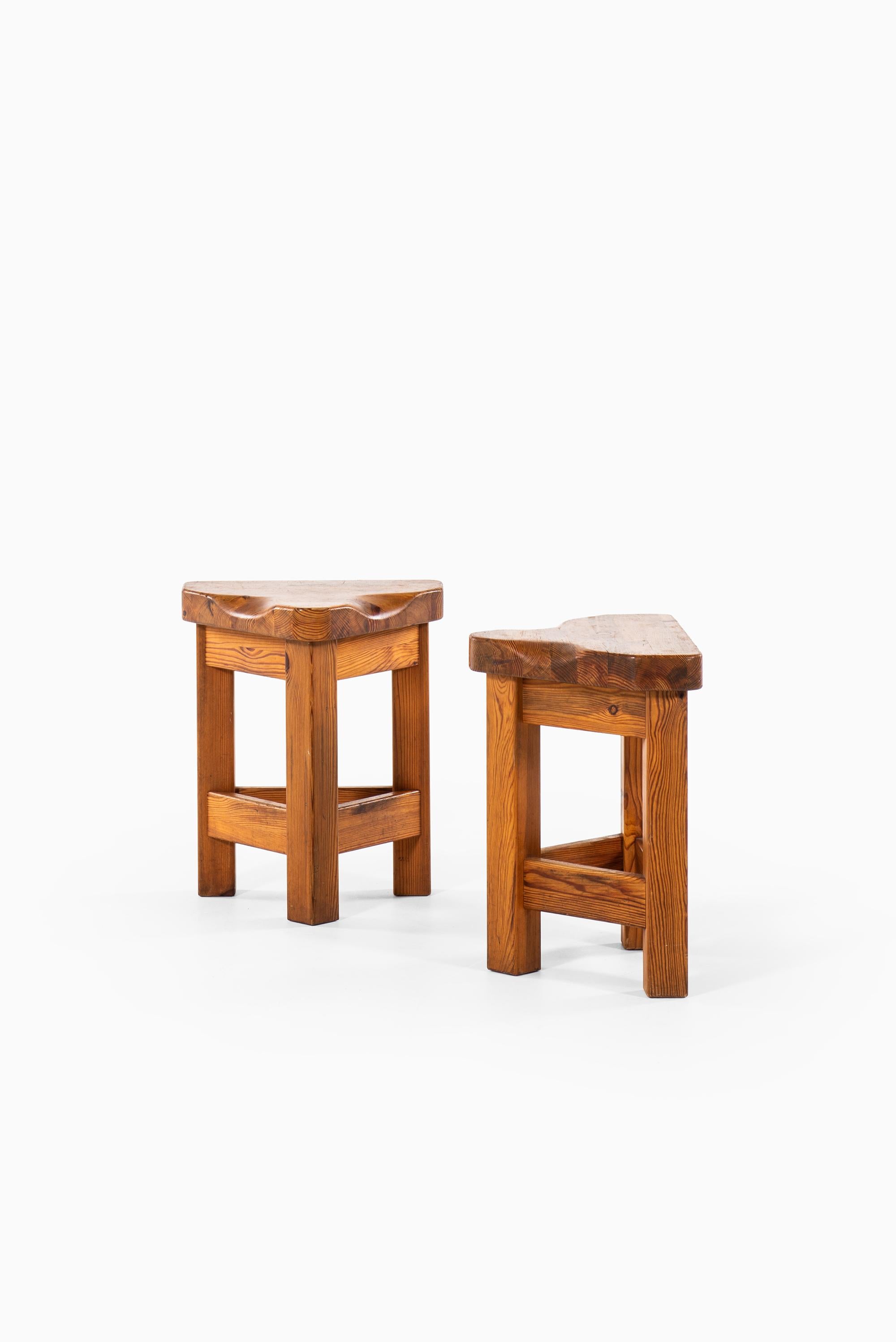 Pair of pine stools in the manner of Roland Wilhelmsson. Produced in Sweden.
