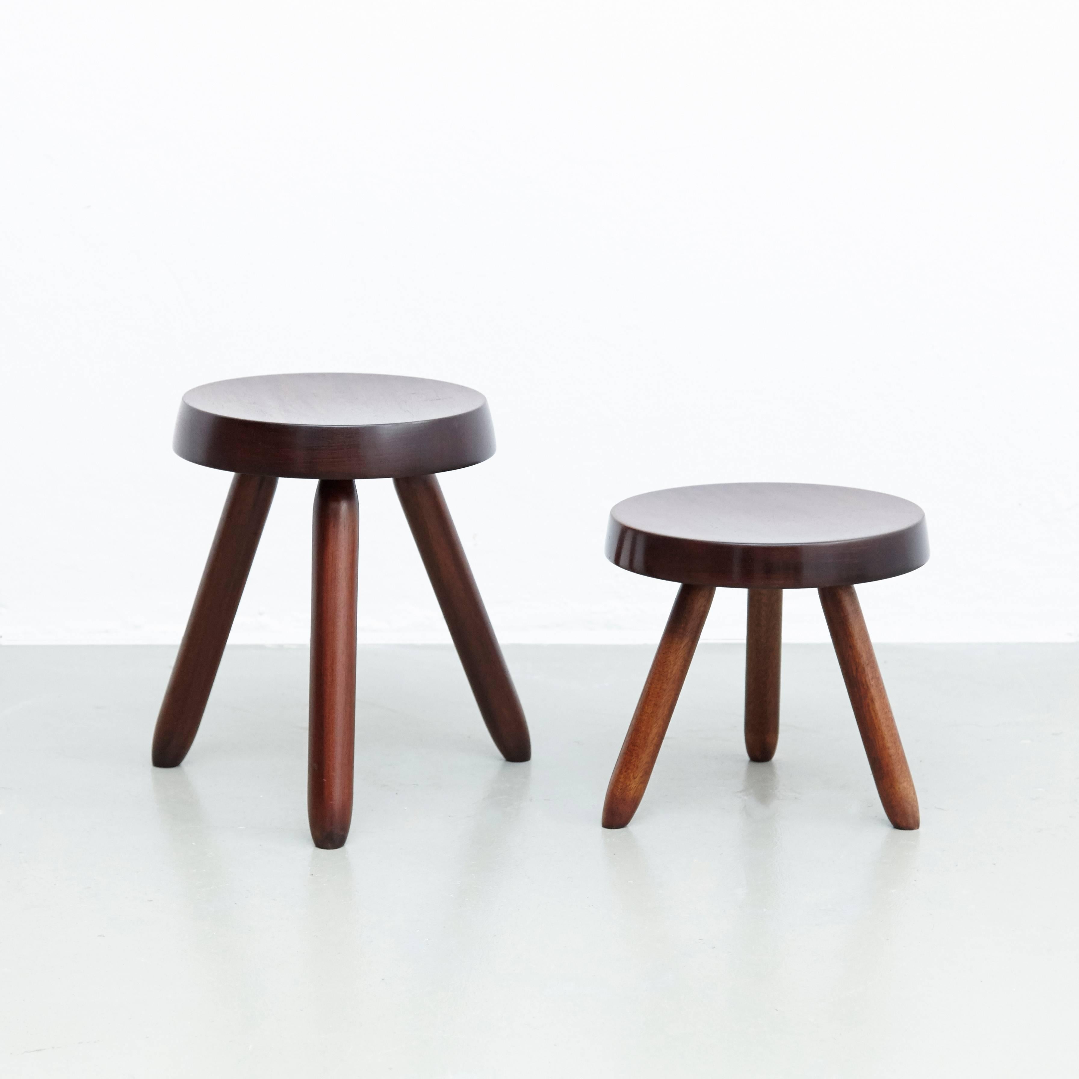 Stools designed in the style of Charlotte Perriand.
Made by unknown manufacturer.

In good original condition, preserving a beautiful patina, with minor wear consistent with age and use. 

Charlotte Perriand (1903-1999) She was born in Paris in