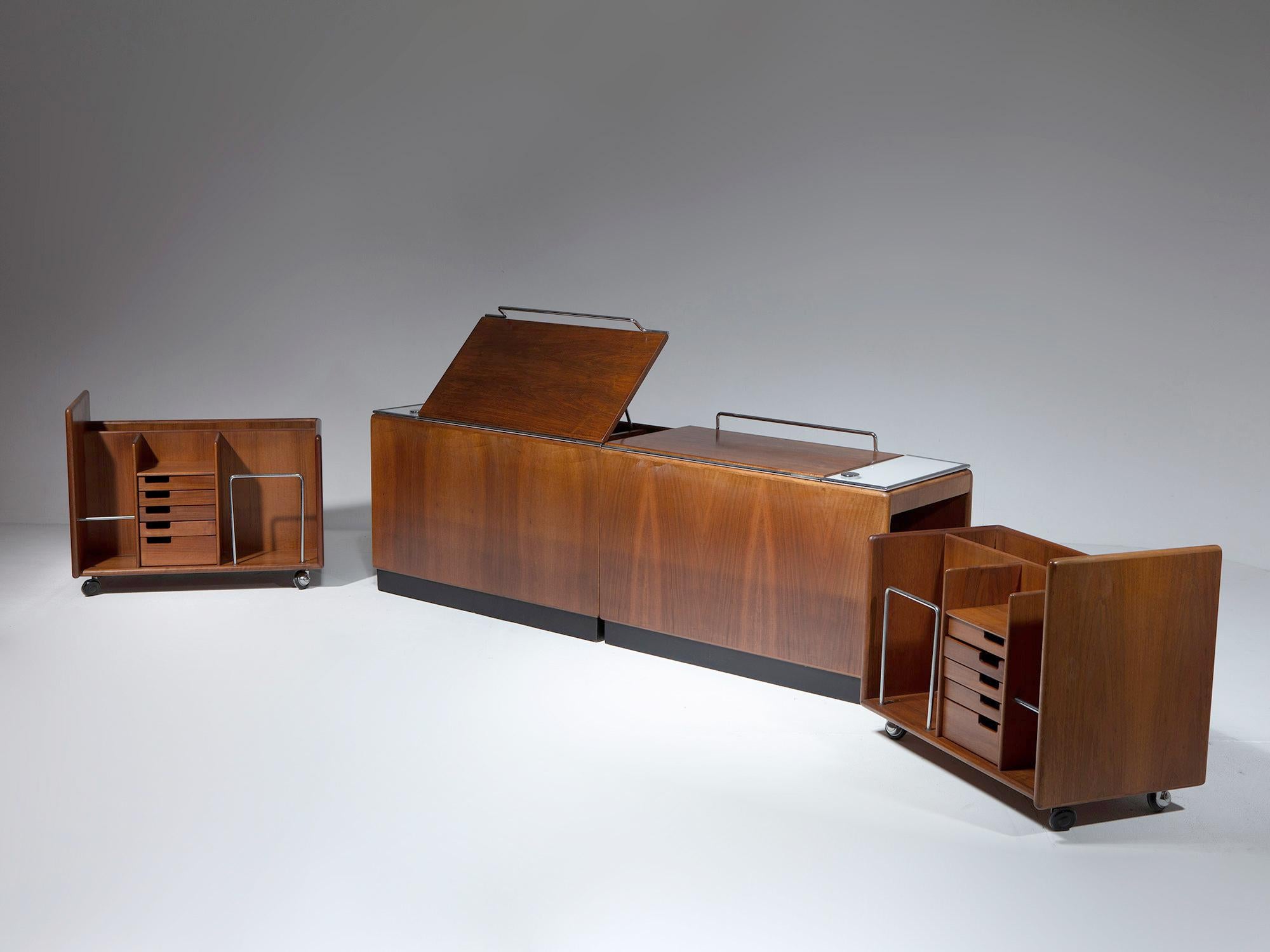 Rare pair of bed-headboards / night stands by Fabio Lenci for Bernini.
Left and right detached elements, feature a main walnut piece with top flip, light and a sliding side element that reveals several drawers and open storage areas.

