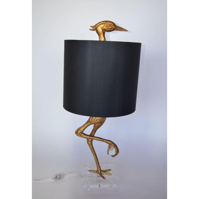 Pair of stork table lamps with black lamp shades. USA, 2000s.