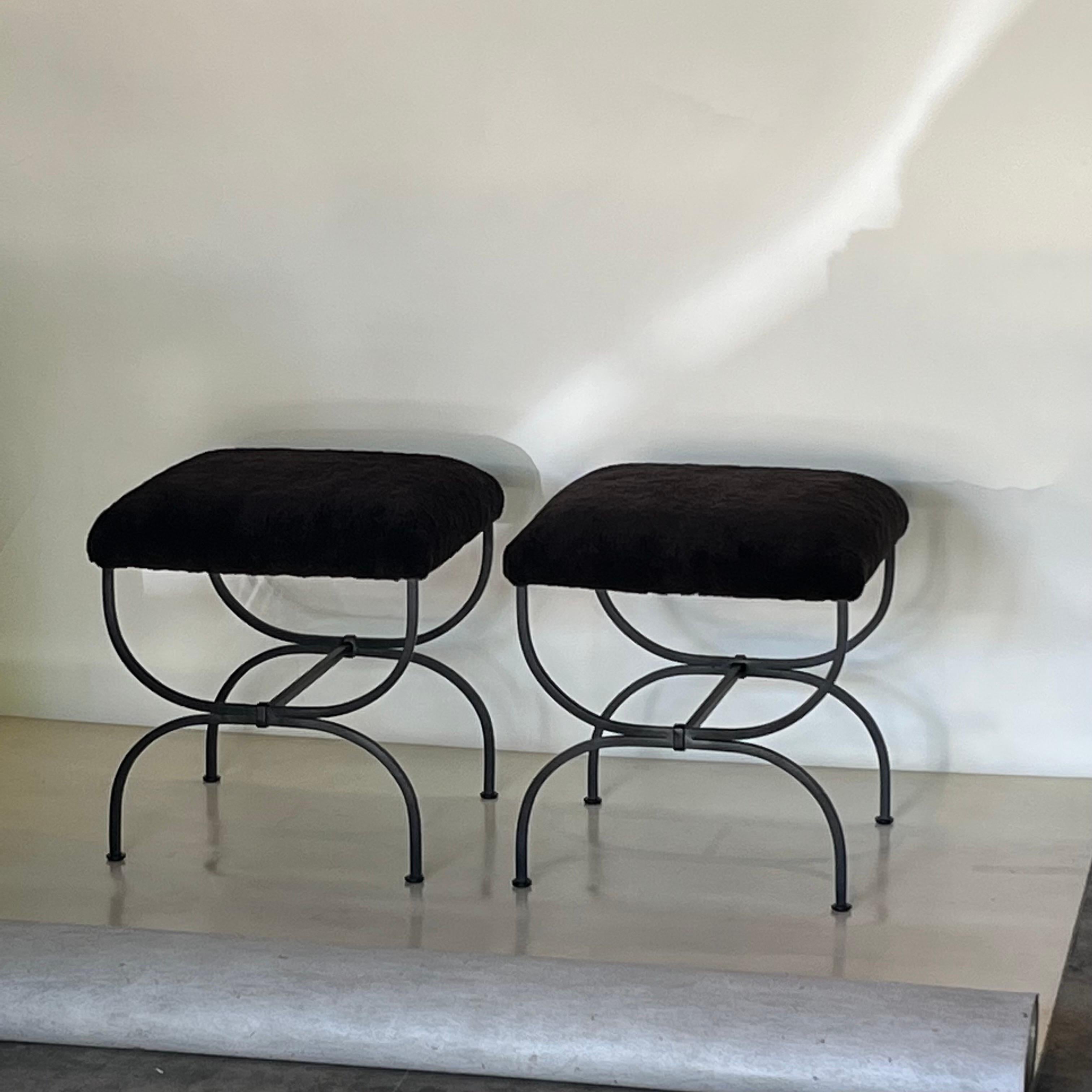 Pair of 'Strapontin' dark gray shearling stools by Design Frères.

Chic and understated.