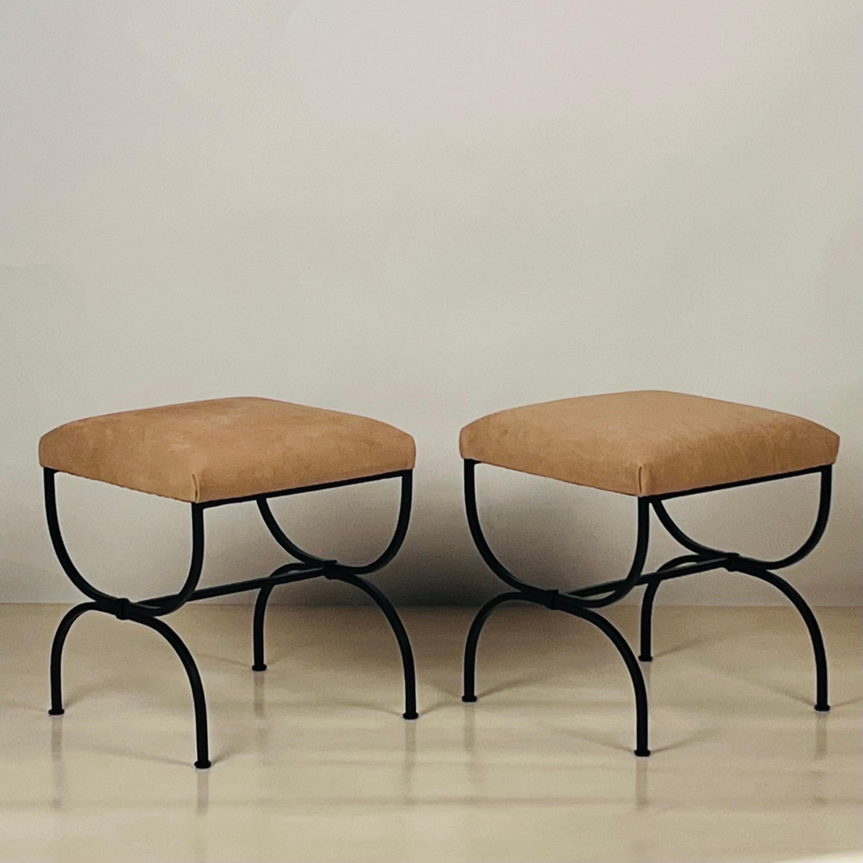 Pair of 'Strapontin' Wrought Iron Stools in Cognac Nubuck Leather by DESIGN FRÈRES®.

Nubuck is top-grain leather that has been sanded or buffed on the grain side, or outside, to give a slight nap of short protein fibers, producing a velvet-like