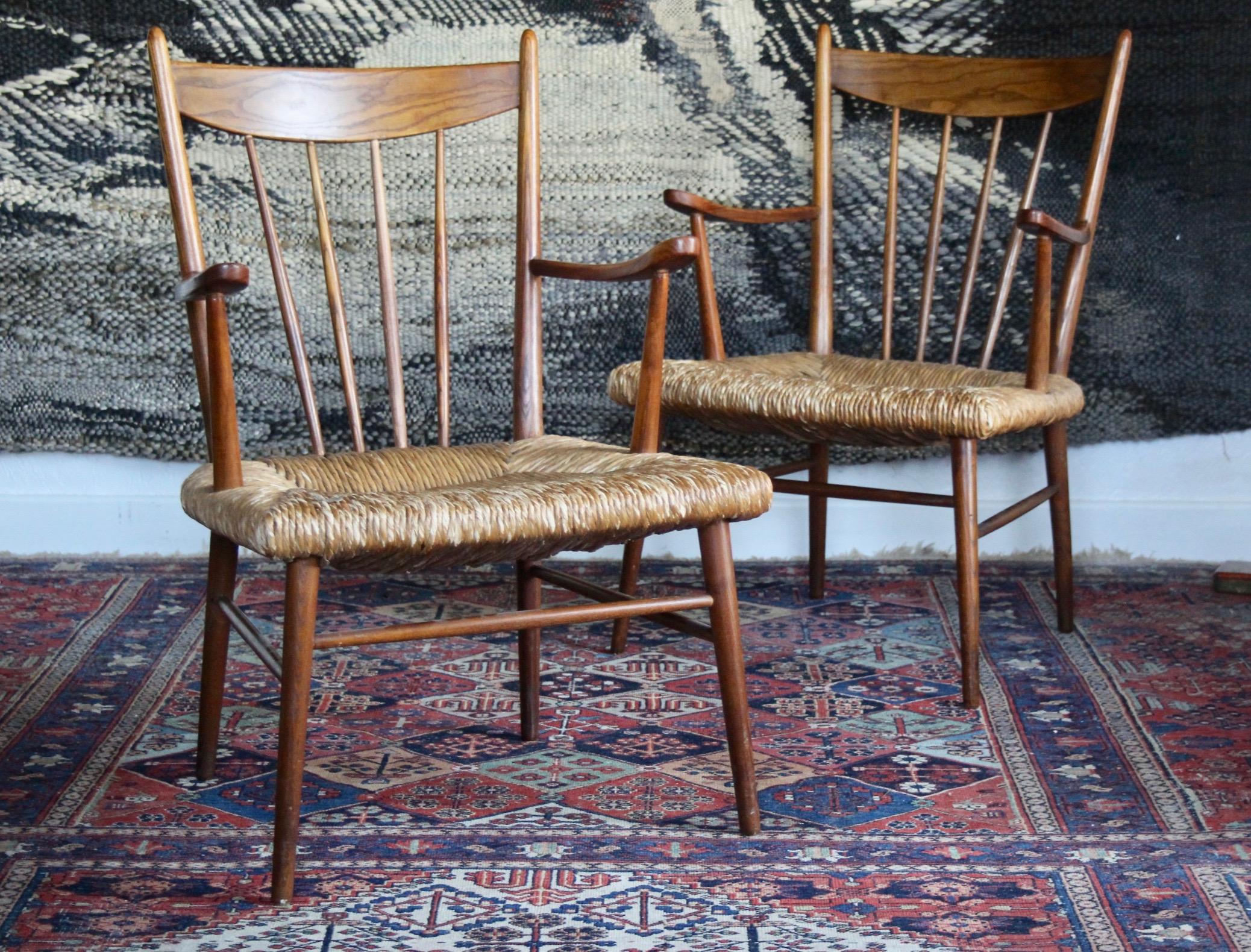 Scandinavian style pair of straw and wooden armchairs. Clean work and hand braiding.