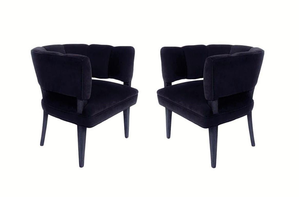 A modern update of a classic. Plush, stylish, and bold these channel tufted barrel chairs are undeniably unique. Each meticulously restored. Artfully crafted with distinctive design showcasing an open back design featuring vertical channel tufting