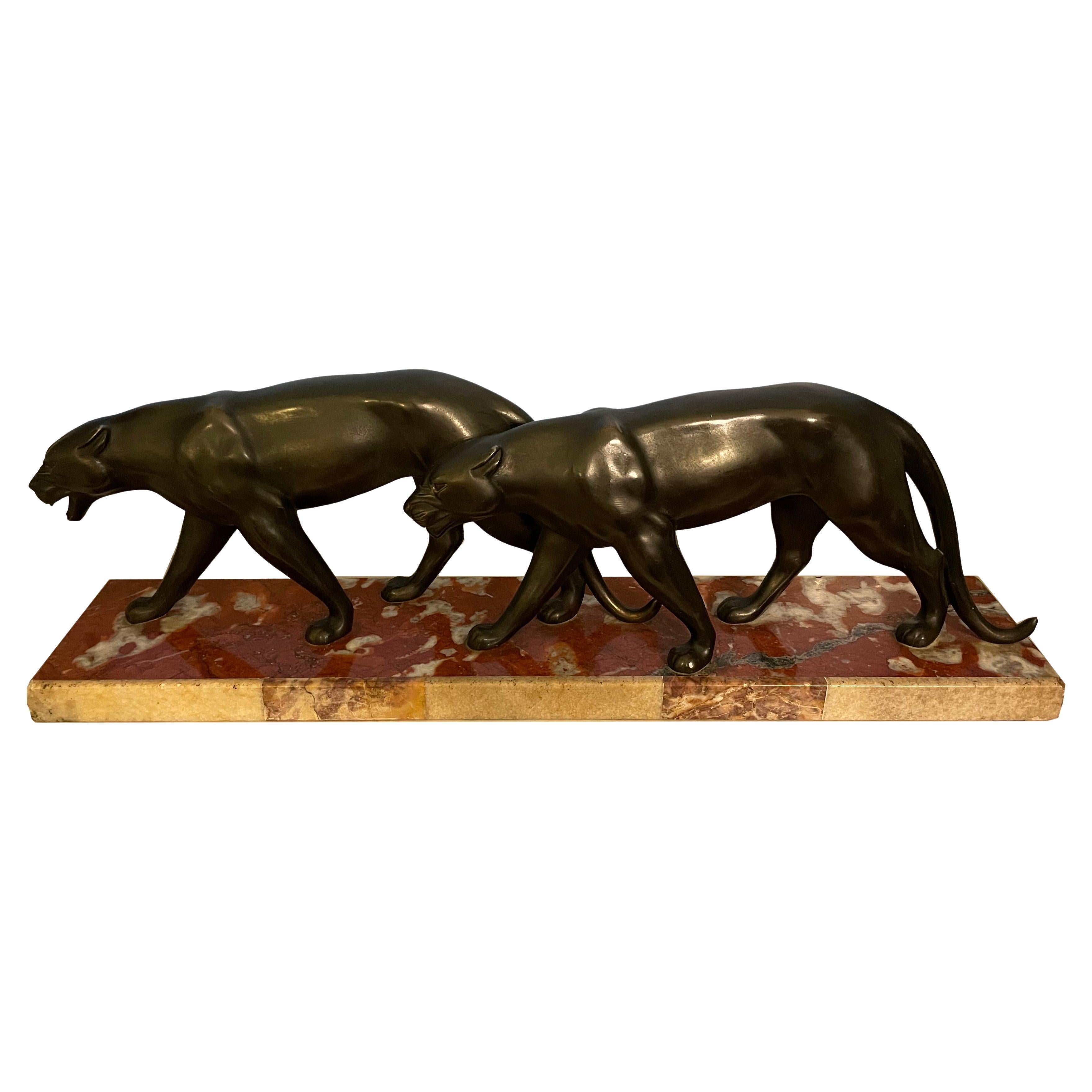 Pair of striding panthers en vente
