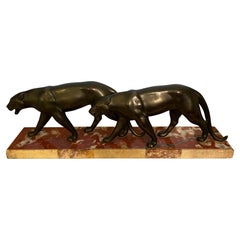 Pair of striding panthers