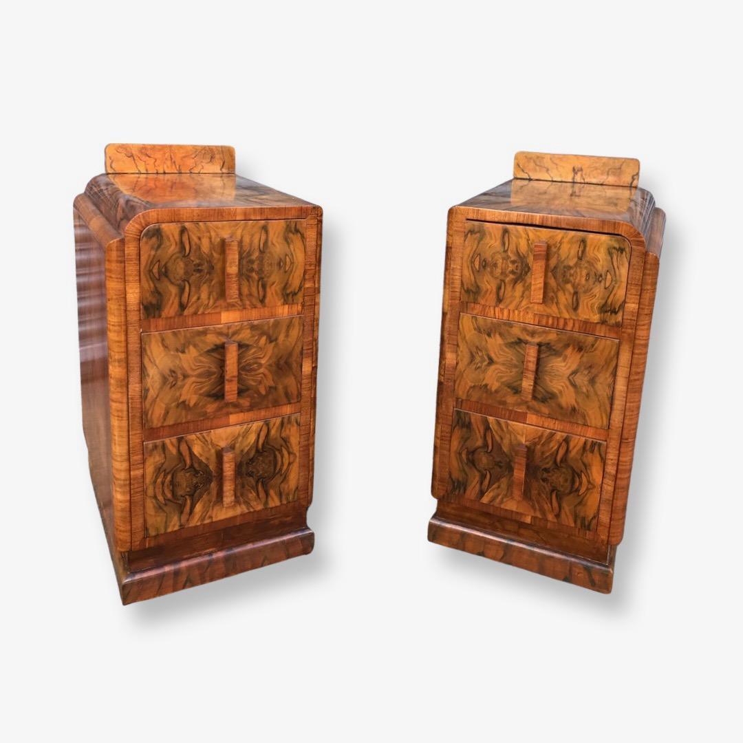 At Art Deco Wardrobes we are excited to be able to offer this wonderful pair of Art Deco period nightstands. Each raised upon an instepped plinth. They feature the most spectacular figured walnut veneering - absolutely gorgeous. The veneering