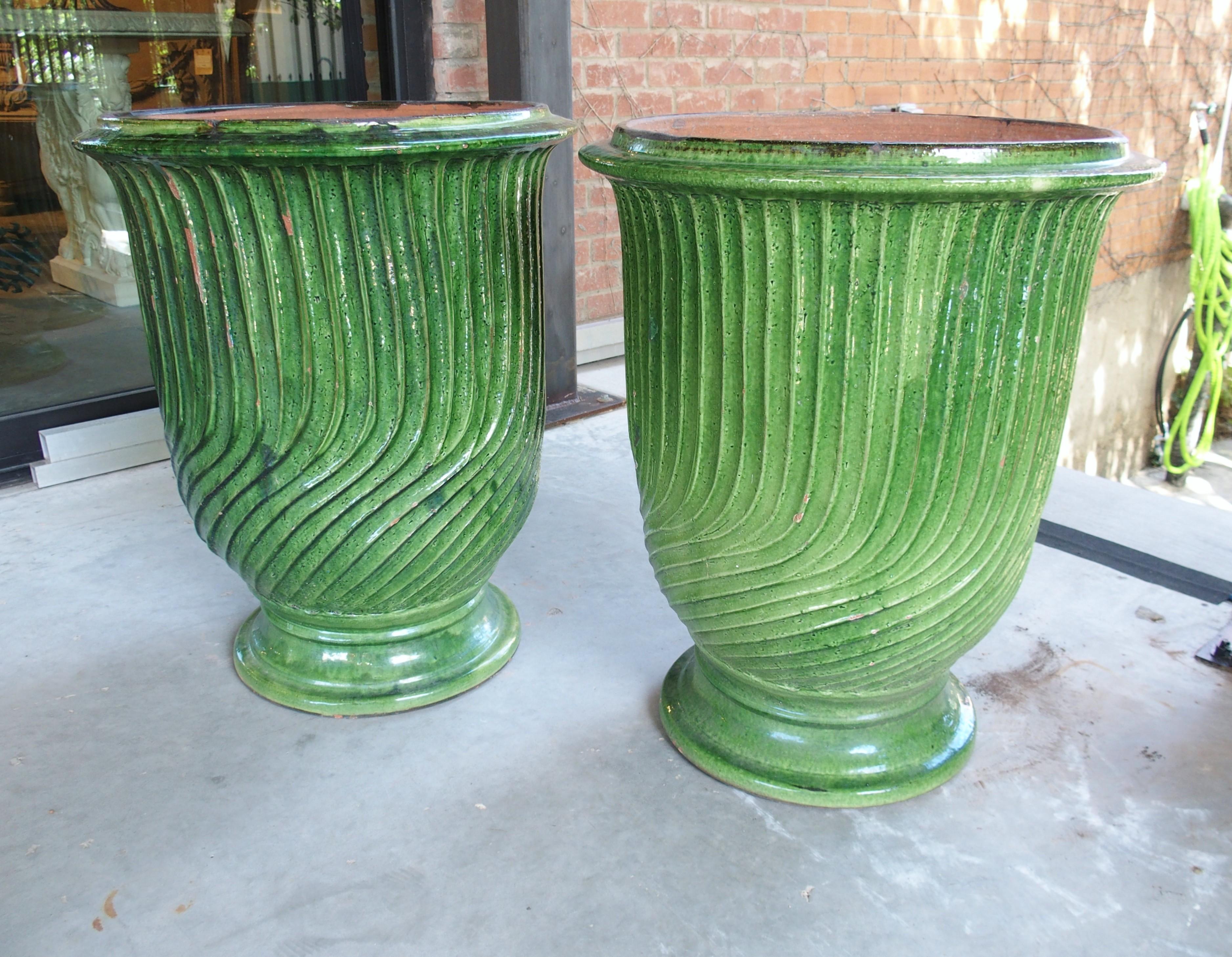 More information coming soon…

This pair of terra cotta anduze pots has a striking luster green painted finish.  The color palette and the striated texture/aesthetics make them quite a unique pair of Anduze pots.