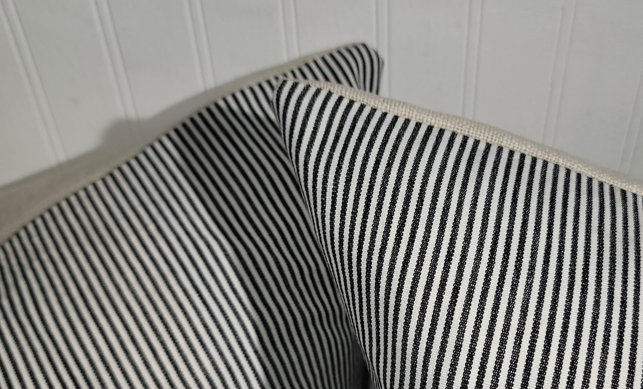 Pair of Striped Cotton Ticking Pillows. Ticking pillows have cotton linen backing. The stripes are thin and narrow throughout the entire front of the pillow.
The linen backing is a wonderful beige. 