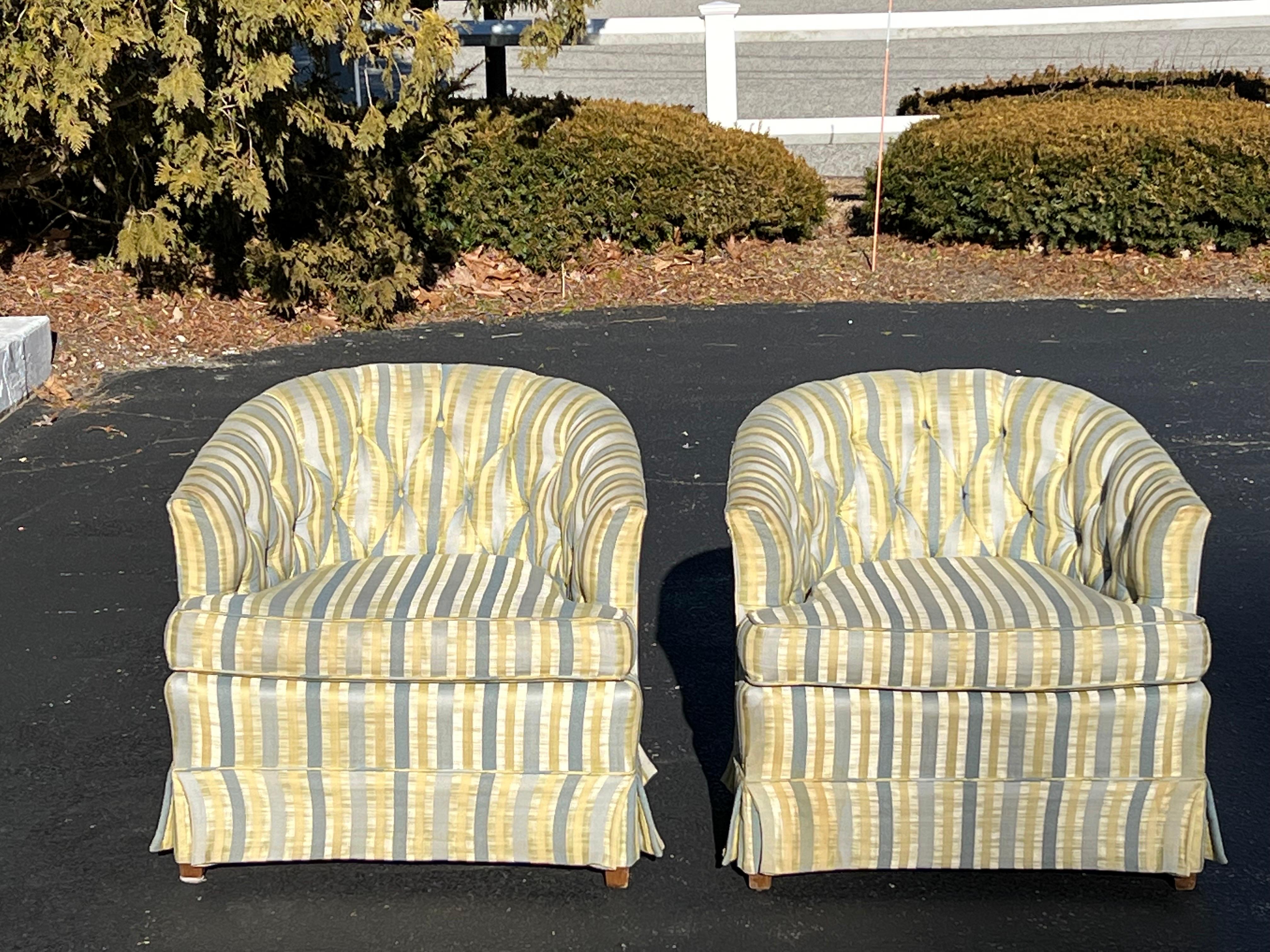 Fabulous pair of striped silk button back chairs. Classic low profile cube shape with button back top. Pleated skirt base with solid wooden feet. Nice for a living room or boudoir. Please request a custom shipping rate since the pre quote is not