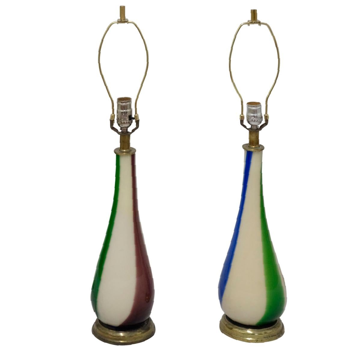 Pair of elegant hand blown, Murano table lamps. Each lamp has three vertical color stripes, red, blue, and green on white opaque background.
