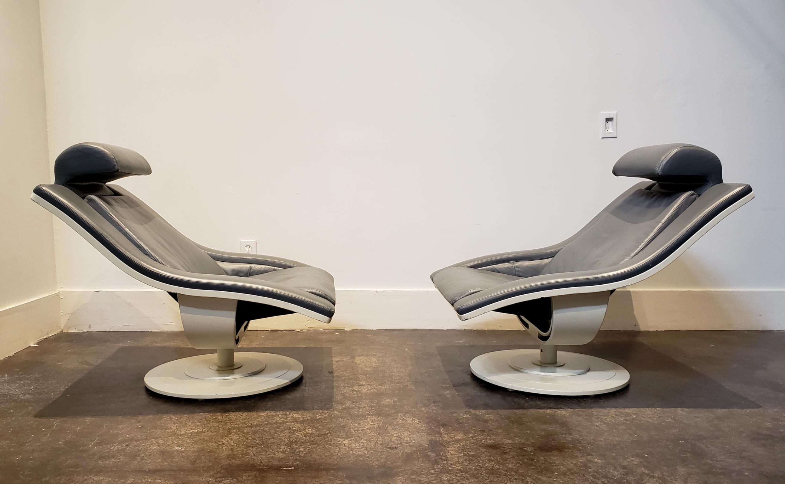 Stunning and unique pair of structural swivel lounge chairs, gray leather and white lacquered wood on pedestal base. Origin unknown but most likely European, circa 1970s. Leather is in very good condition, small losses to lacquered bases (see