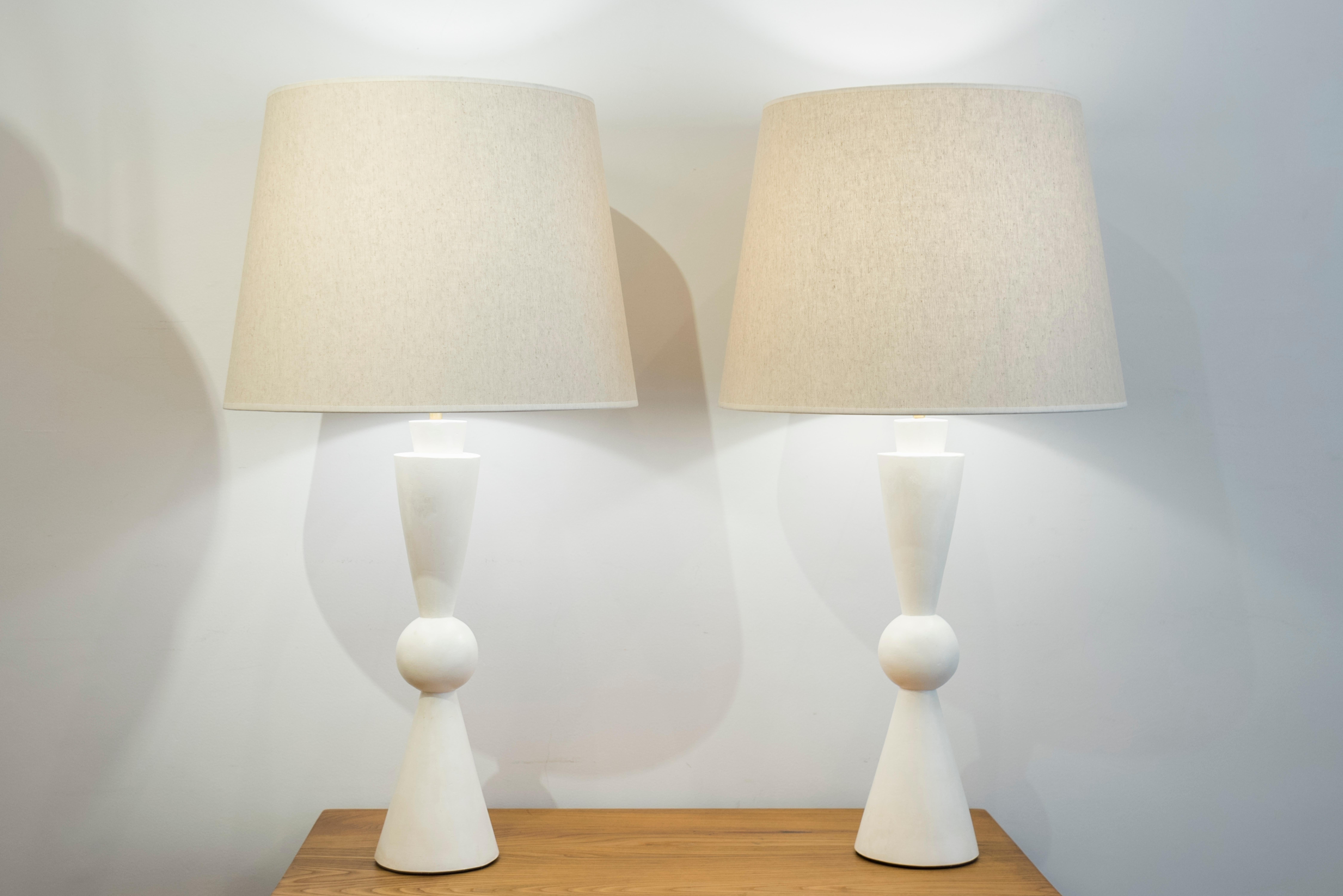 A pair of stuccoed plaster lamps, inspired by Jean-Michel Frank
Model: Quille
France, contemporary creation.

Dimensions:
Height total 84 cm (33.07 inches)
Height plaster foot 49 cm (19.29 inches)
Diameter 45 cm. (17.7 inches).