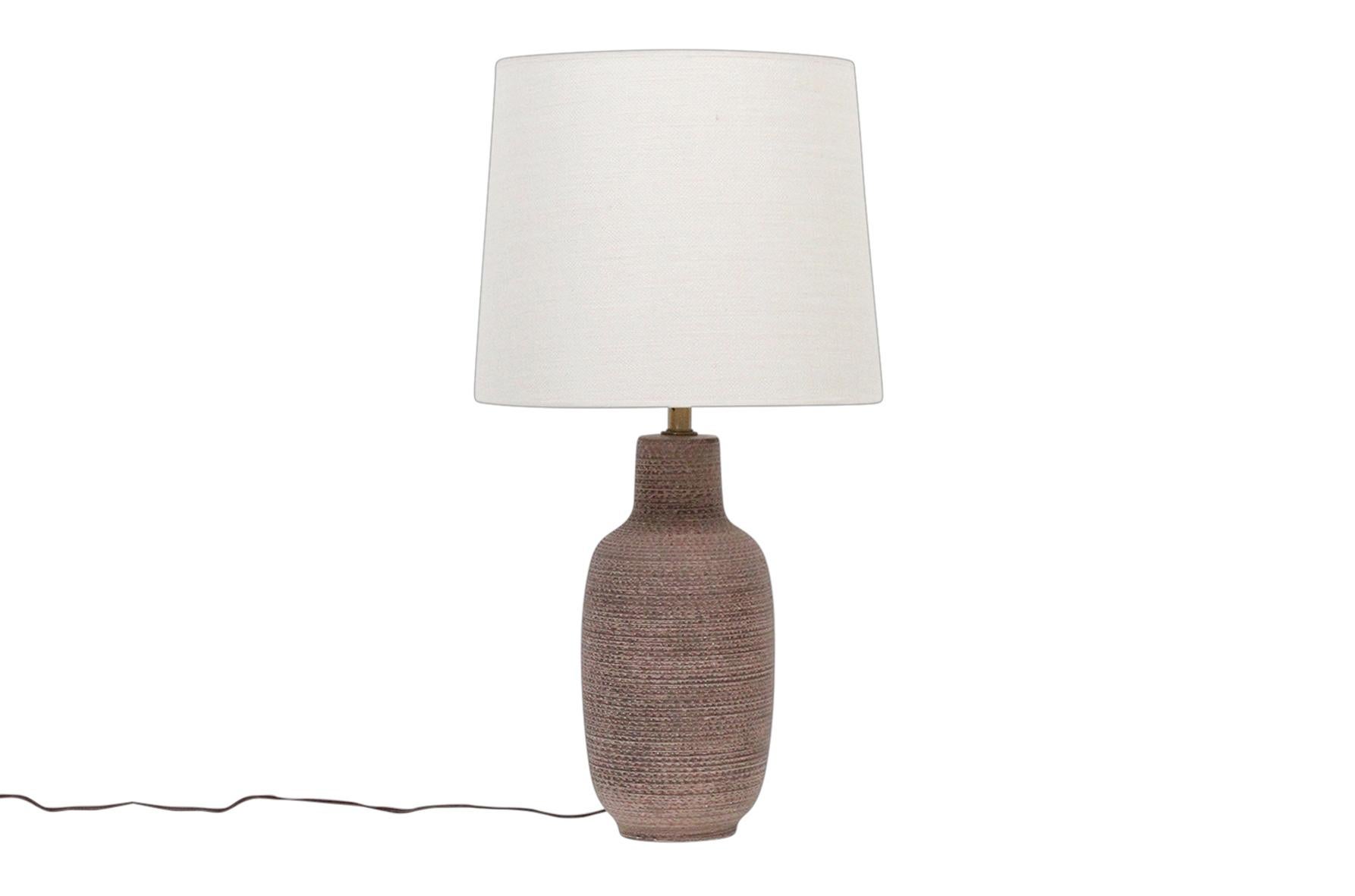 Pair of ceramic table lamps by Lee Rosen for Design Technics. These examples feature a studded glaze referred to as 