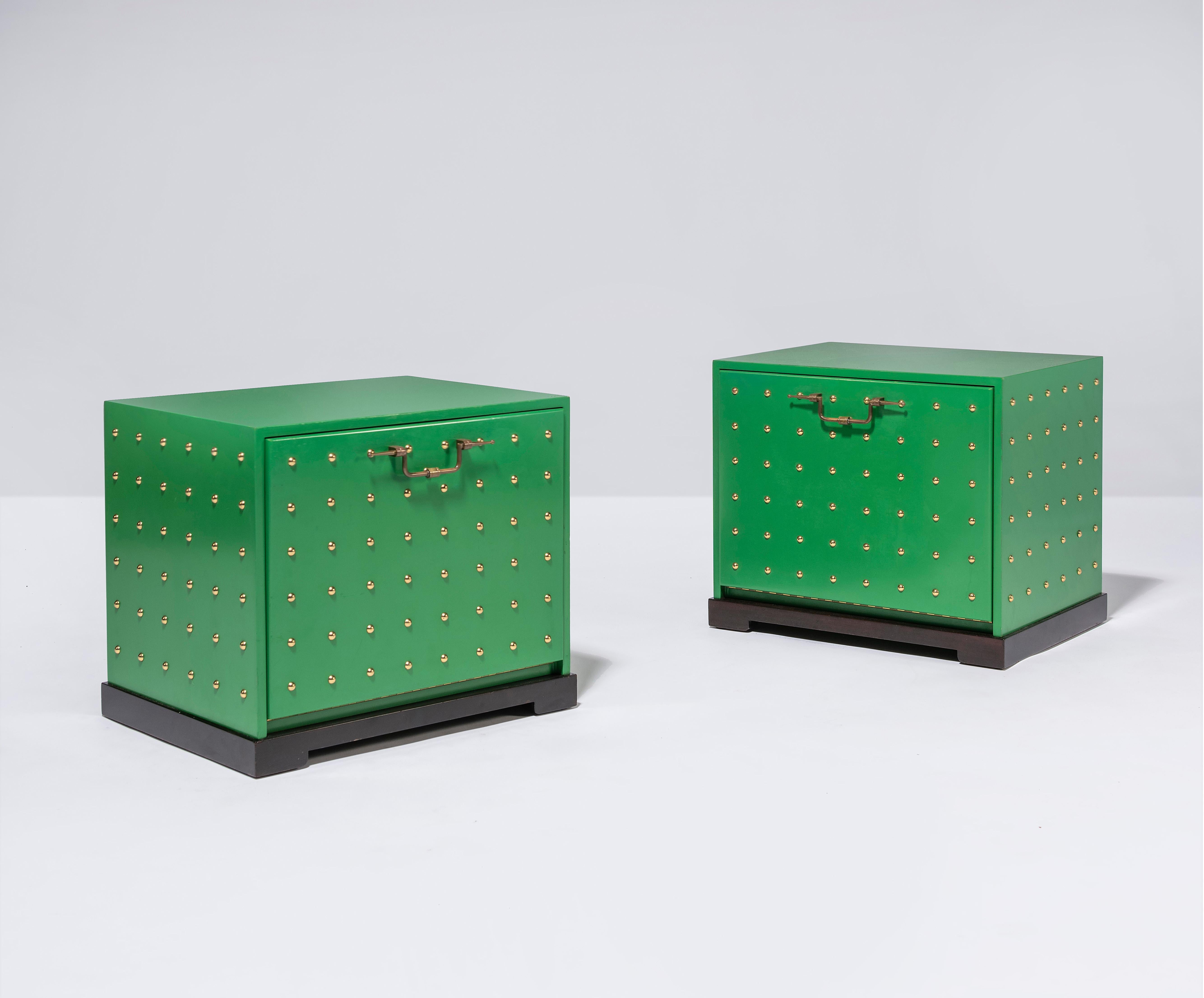 Pair of original green lacquered studded chests by Tommi Parzinger for Parzinger originals.

Chest can be used as nightstands or end tables.