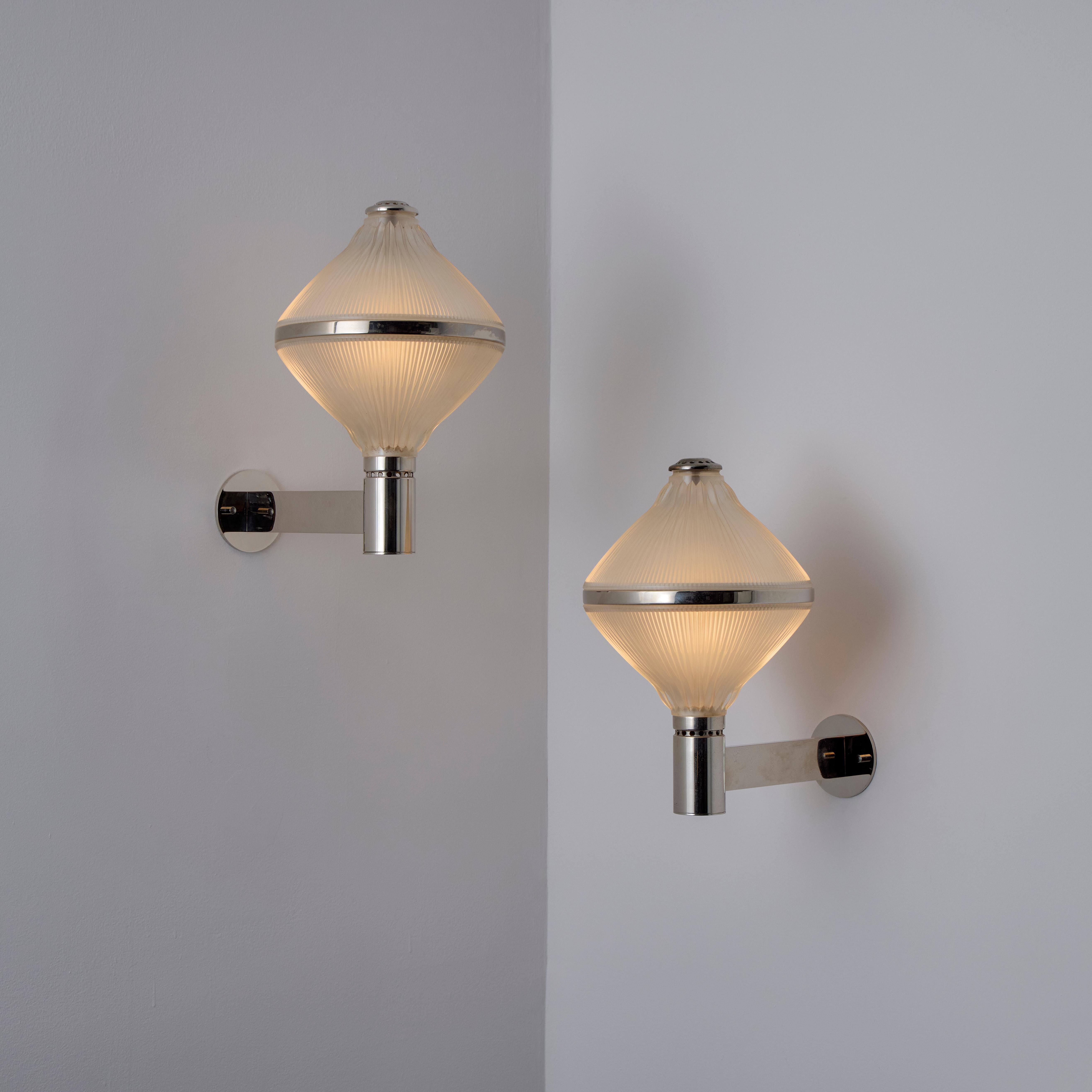 Pair of Studio B.B.P.R. Sconces. Designed and manufactured in Italy, circa the 1960s. Polished Nickel and reeded glass diffusers. Each sconce holds a single E27 socket type, adapted for the US. Rewired for the US. Sold as a pair only. 