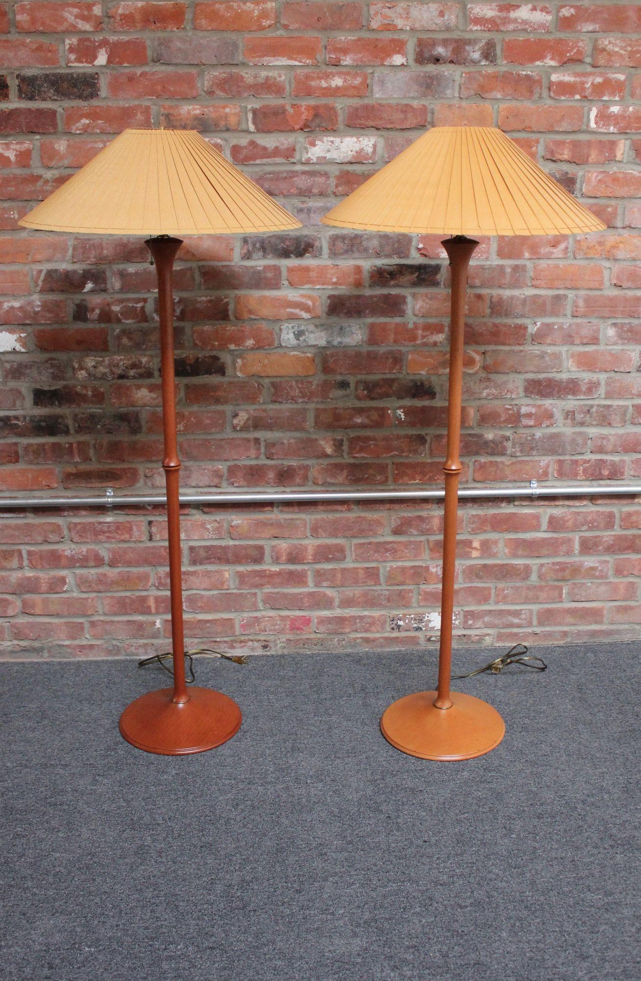 Pair of sculptural cherrywood floor lamps with brass accents and original paper shades (Vermont, USA, 1995).
Each lamp has a double-socket accommodating two bulbs with two on/off pull-string switches and has been newly rewired.
Excellent, vintage