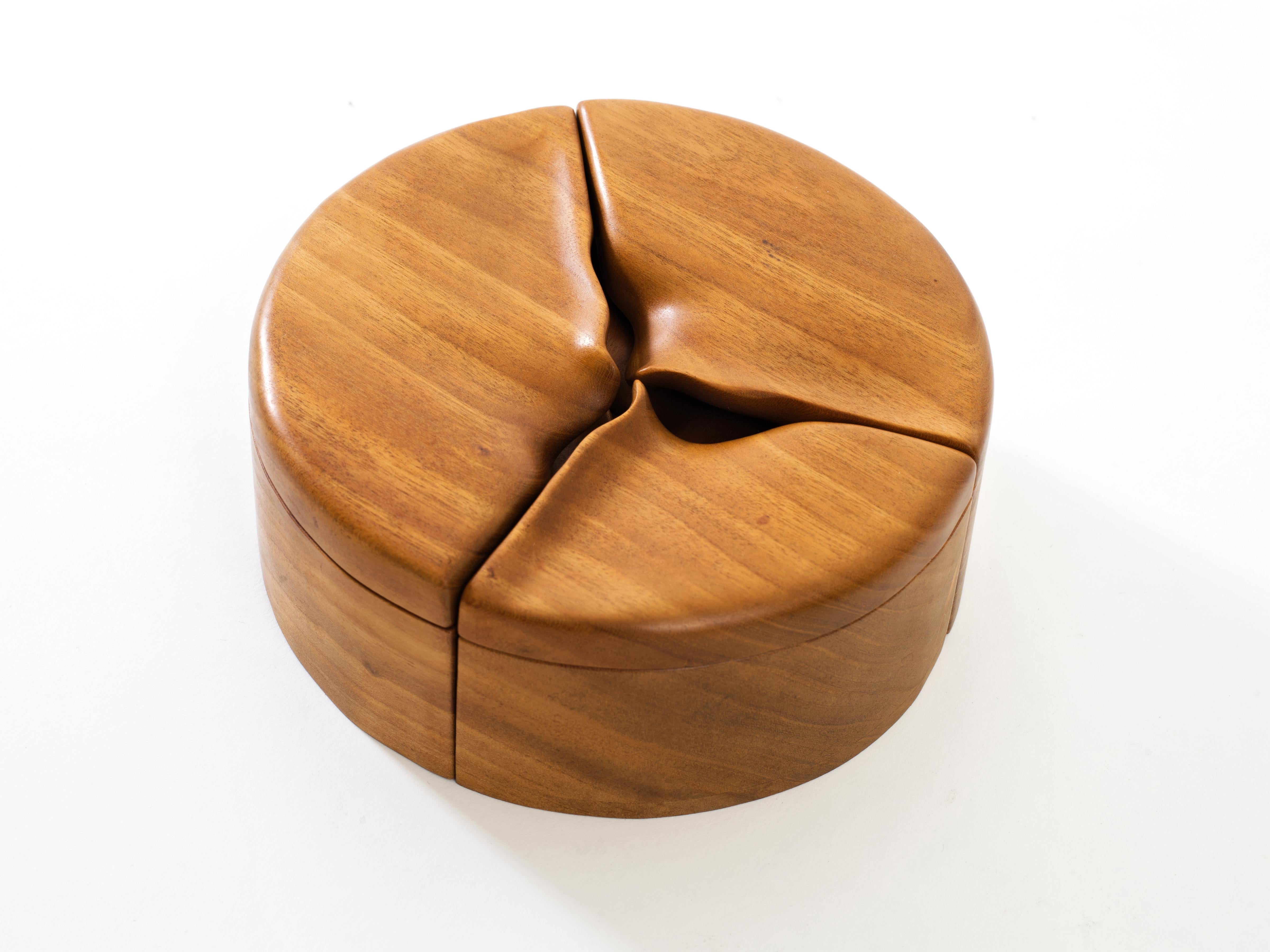 An alluring pair of handmade nesting boxes in contrasting finishes and with sensually carved lids, each separating into smaller components perfect for storing small objects such as jewelry. Beautifully crafted and tactile desktop or tabletop