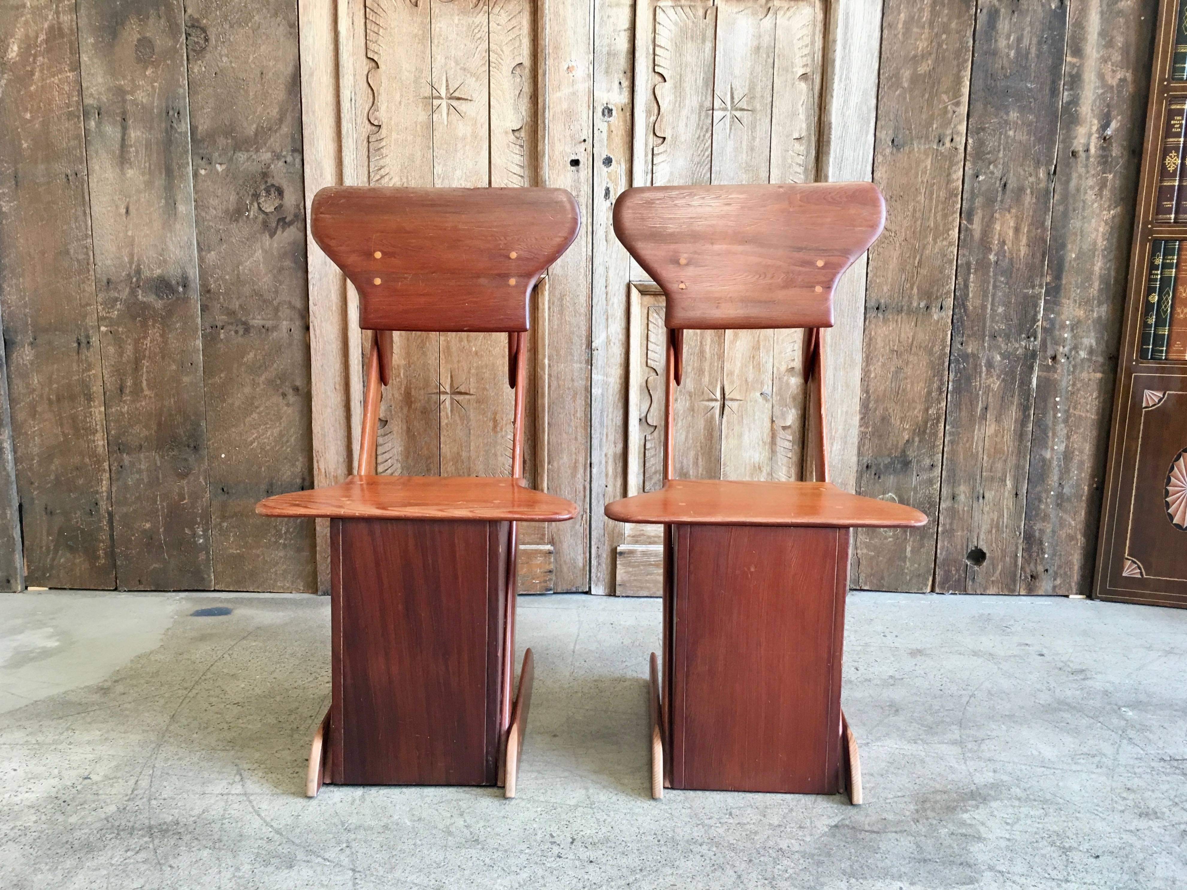 Rustic worn pine Mid-Century Modern chairs with that alpine chalet feel.