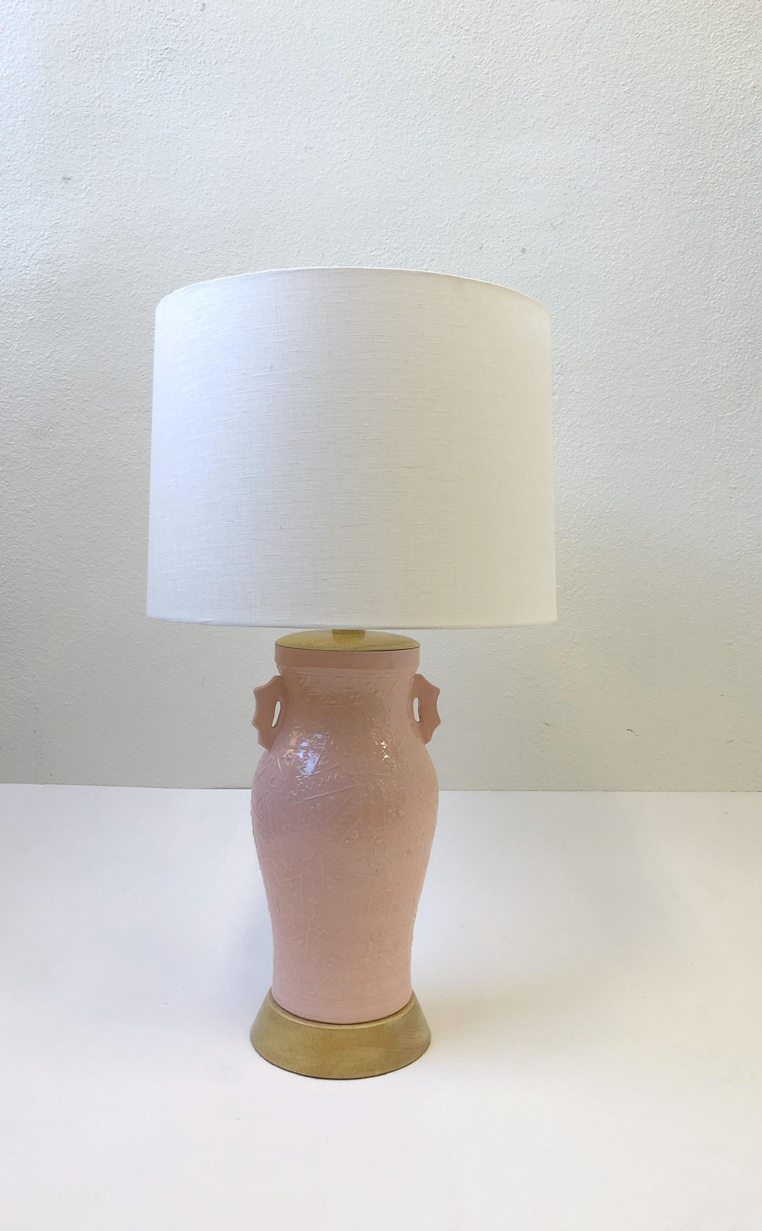 A beautiful pair of 1980s pink glazed Studio ceramic table lamps designed by Roy Hamilton for Steve Chase. The lamps have been newly rewired, but retain the original hardware. New vanilla linen shade. Both lamp are signed Roy Hamilton and noted for