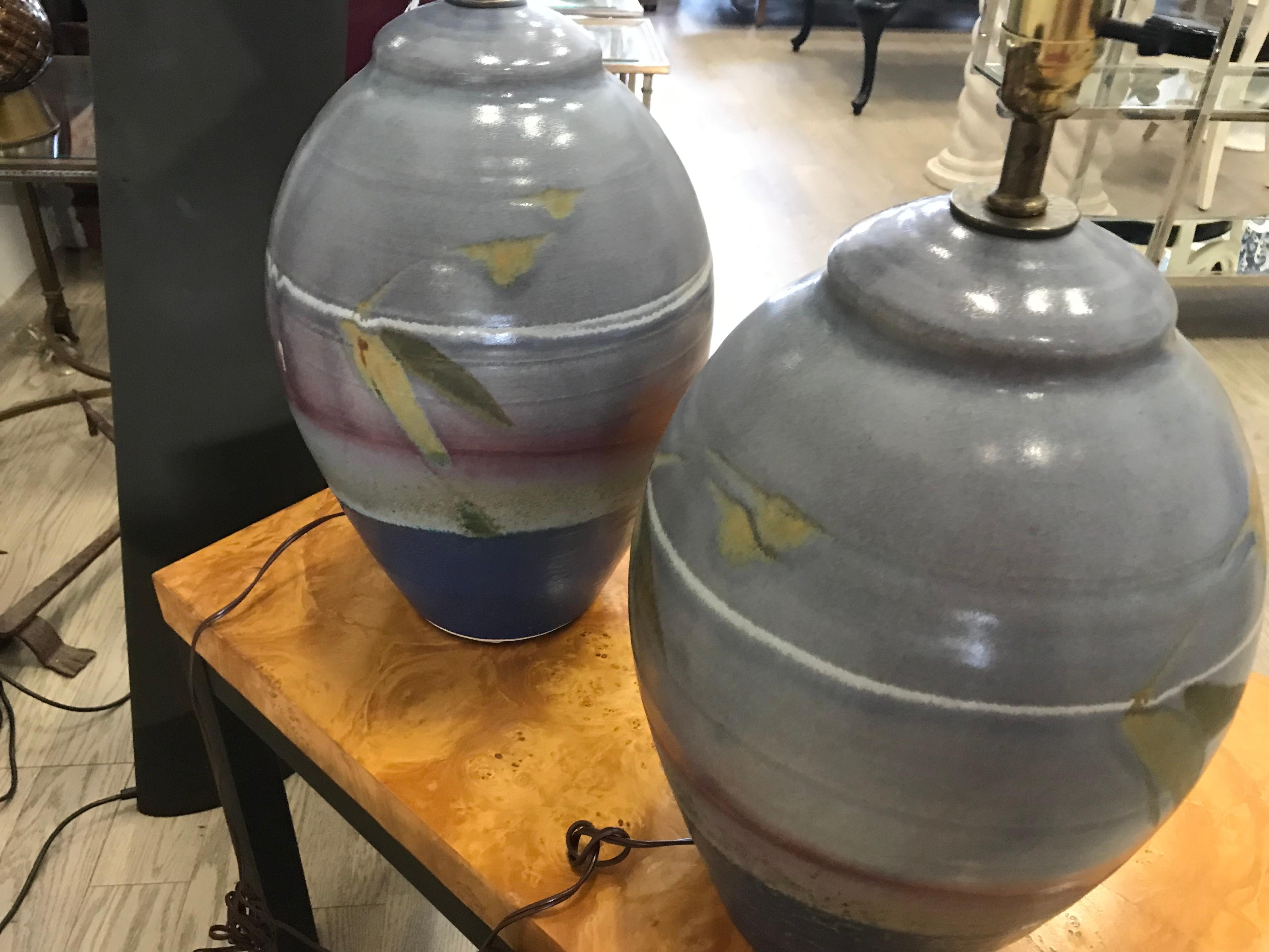 This is a nice pair of studio pottery lamps. They are in nice condition. I suggest to have them rewired.