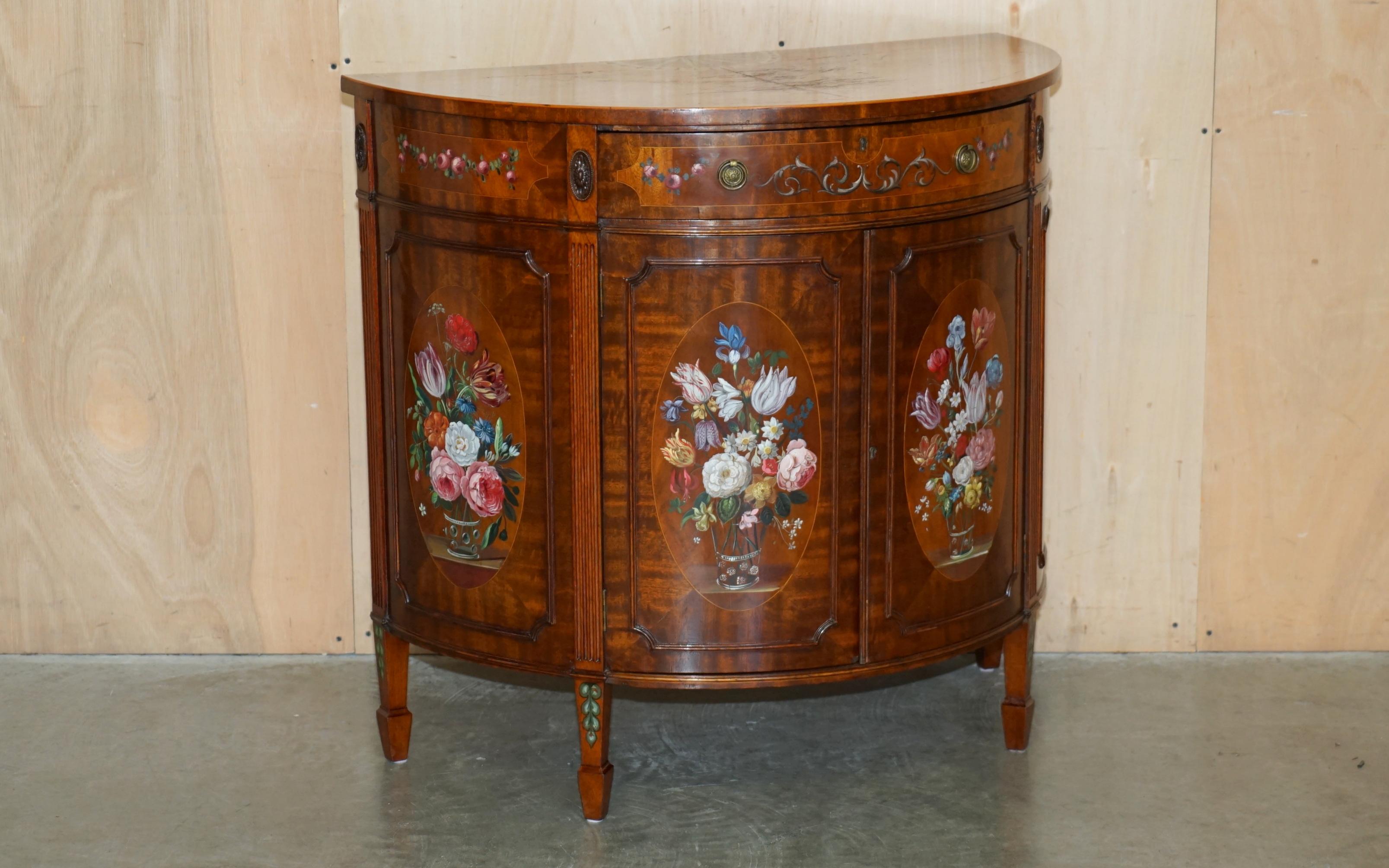 Royal House Antiques

Royal House Antiques is delighted to offer for sale this exquisite pair of hand made in England Demi Lune sideboards with Adams Sheraton Revival style paintings 

Please note the delivery fee listed is just a guide, it covers