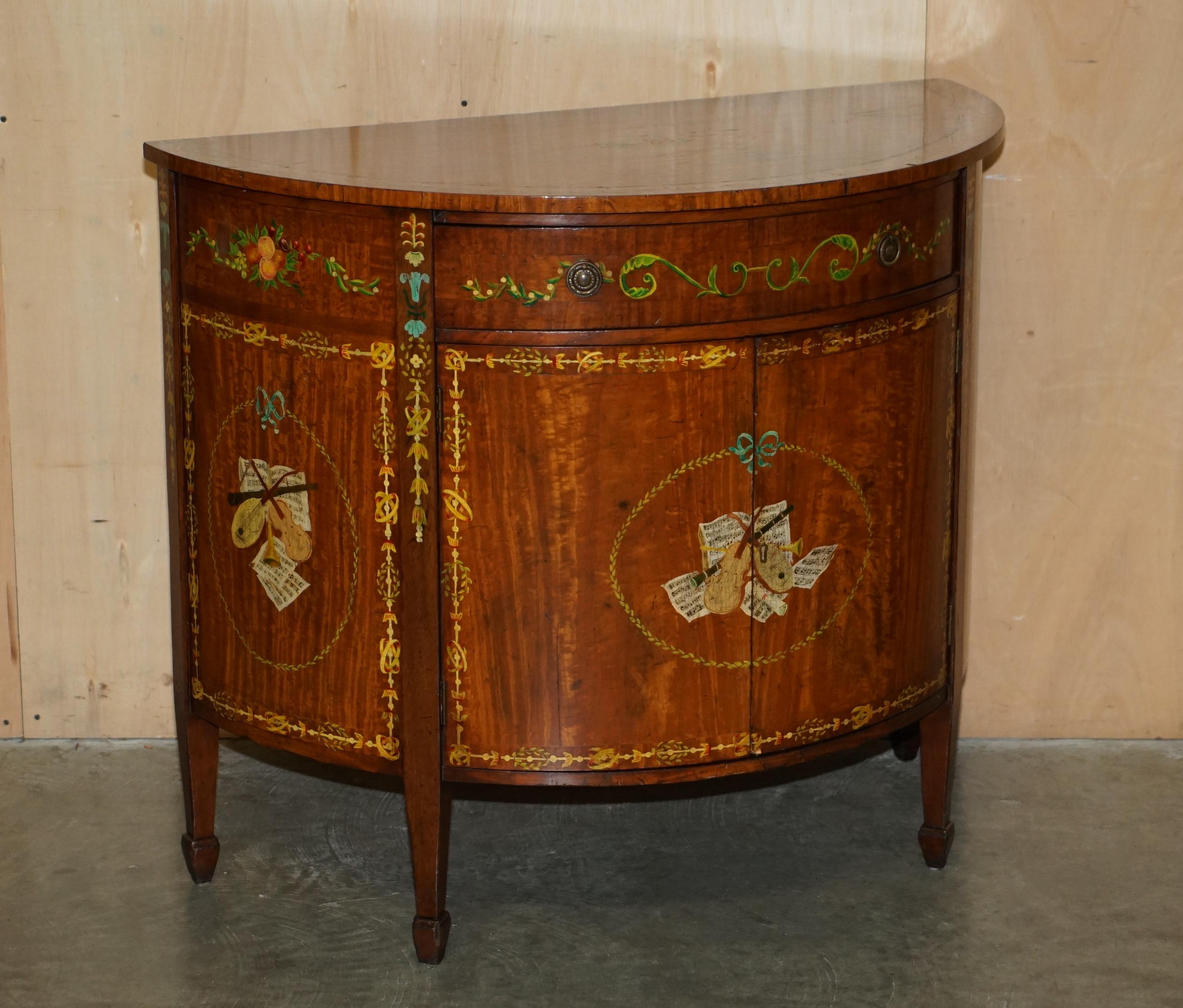 Royal House Antiques

Royal House Antiques is delighted to offer for sale this exquisite pair of hand made in England Demi Lune sideboards with Adams Sheraton Revival style paintings 

Please note the delivery fee listed is just a guide, it covers
