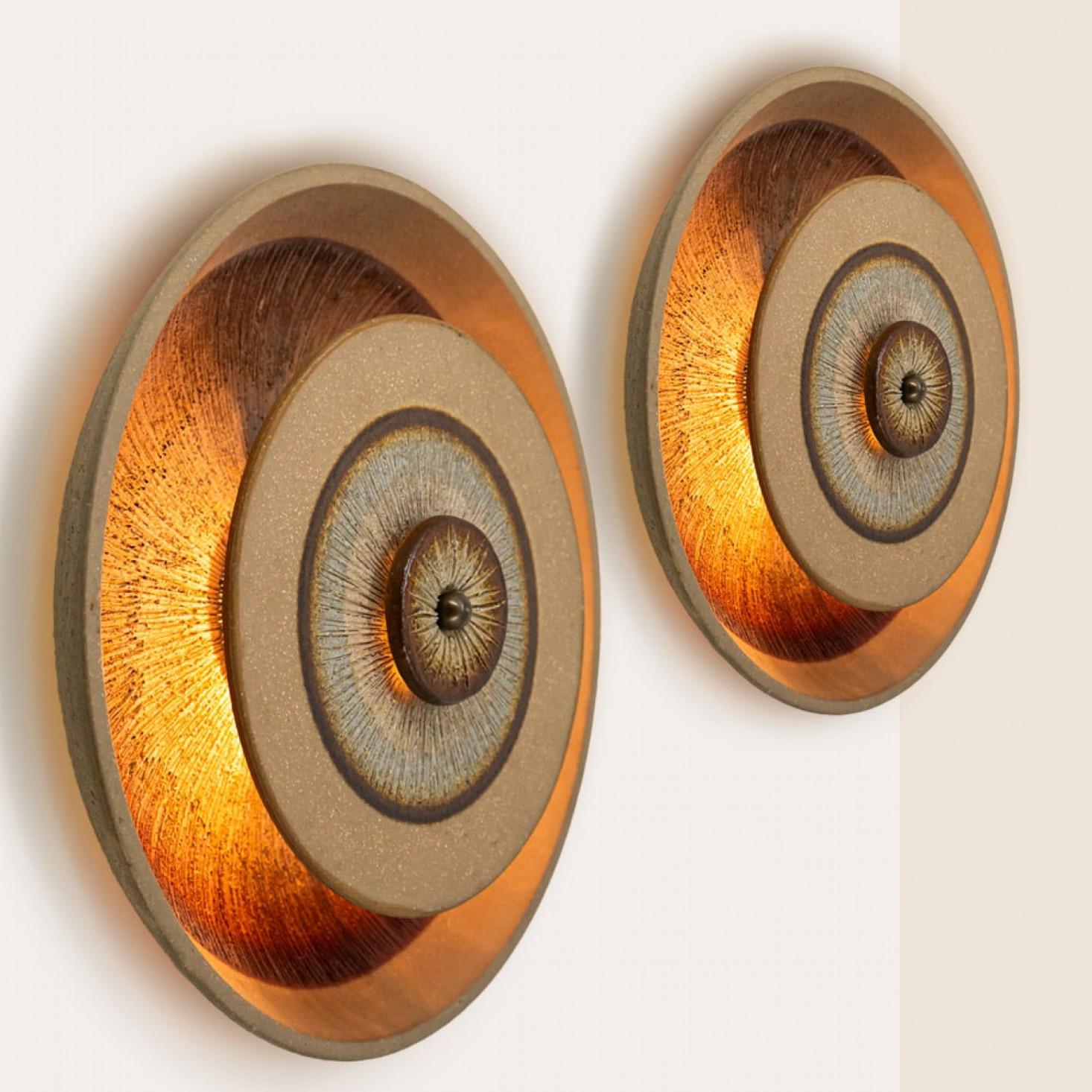 Spectacular circular ceramic wall light, with beautiful  accents. Manufactured in Denmark in the 1970s.

Cleaned, well-wired and ready to use
The fixture requires 1 E14 standard bulb.

