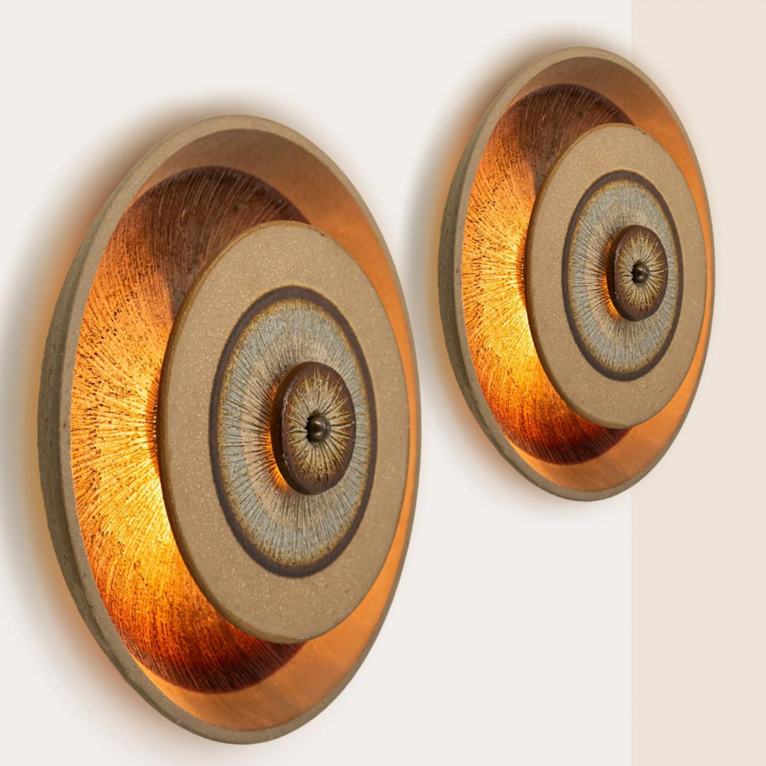 Spectacular circular ceramic wall light, with beautiful  accents. Manufactured in Denmark in the 1970s.

Cleaned, well-wired and ready to use
The fixture requires 1 E14 standard bulb.

