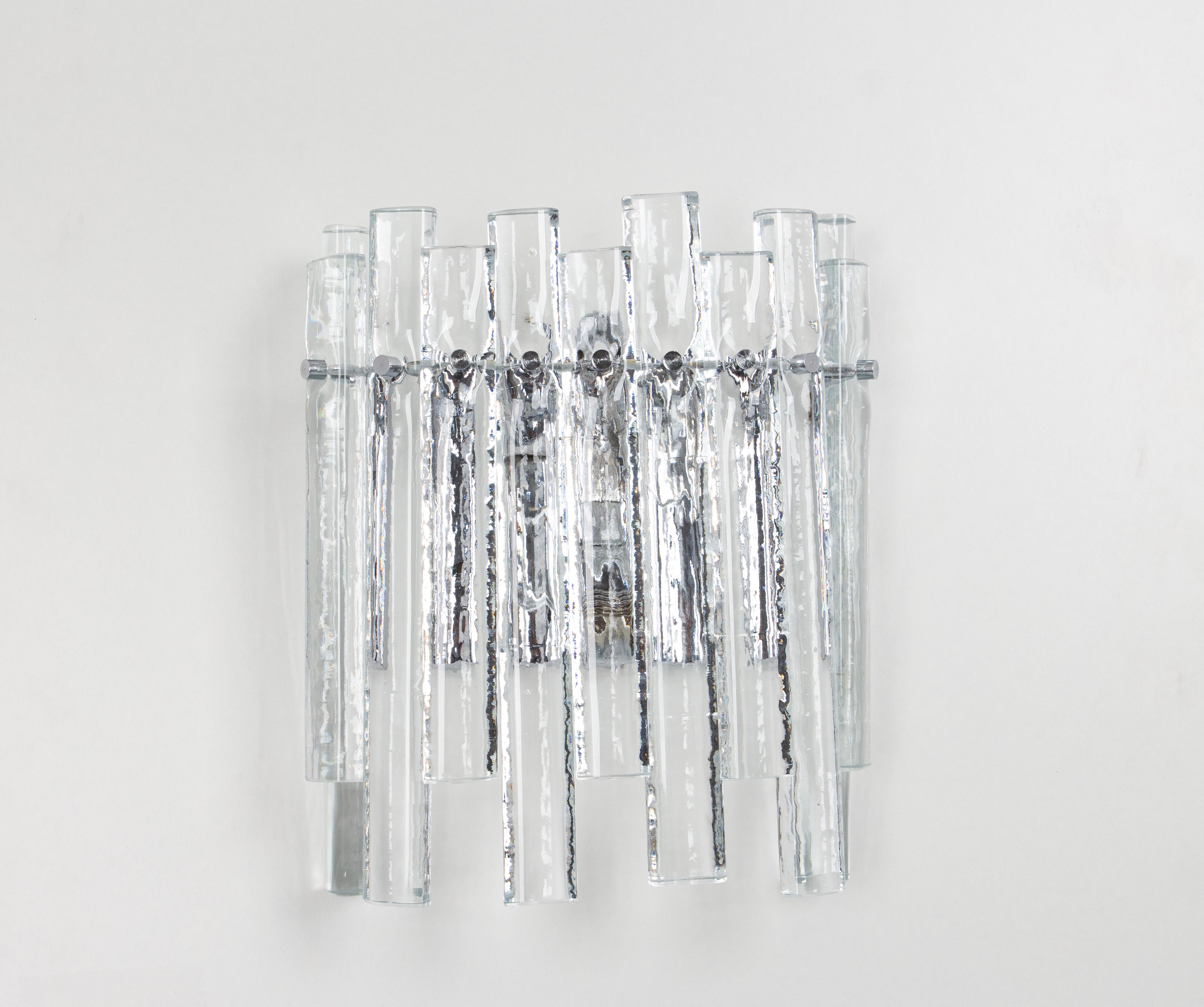 A stunning pair of chrome sconces with crystal glasses, made by Kinkeldey, Germany, circa 1970-1979. It’s composed of crystal glass pieces on a chrome frame.
From the Serie: Cascade

Best of the 1970s from Germany

Heavy quality and in very good