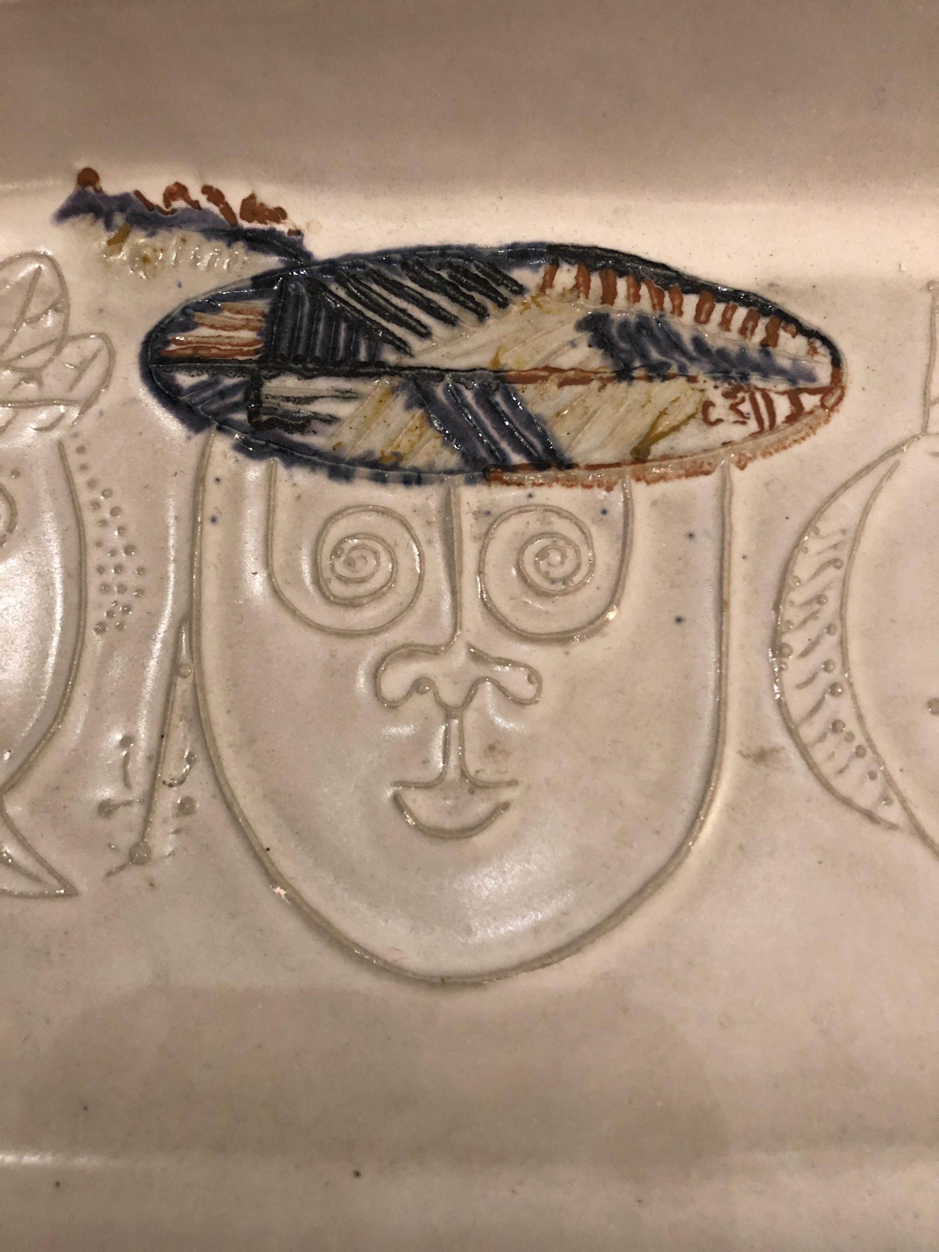 Two wonderful early ceramic trays by Bennington Potters' founder David Gill, one in white, one in a very dark grey. Each has 3 whimsical faces or Kings in a PIcassoesque style.