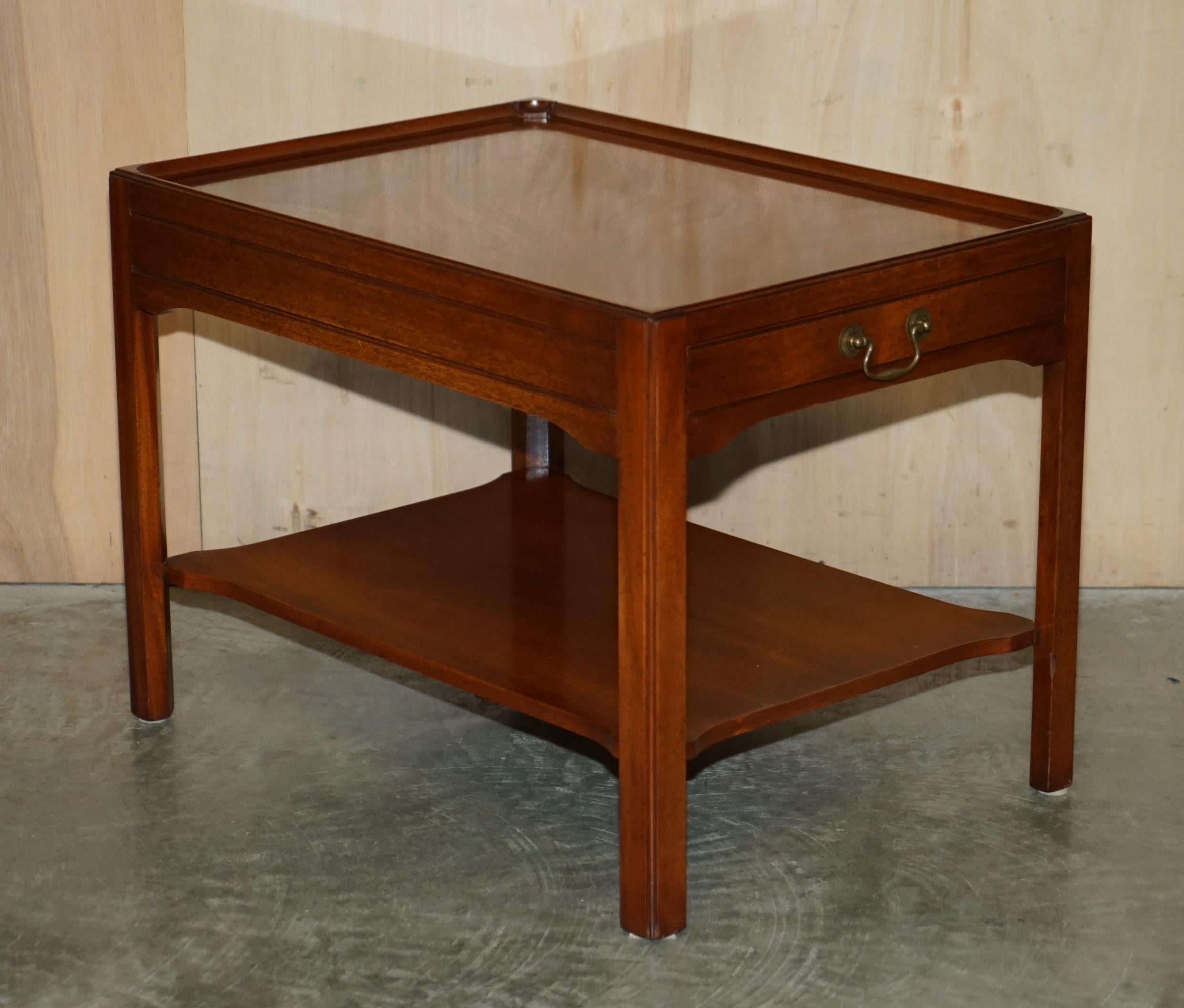 We are delighted to offer for sale this lovely pair of long Flamed Mahogany side end lamp wine tables with large single drawers to the front and faux dummy drawers to the rear

A good looking well made and desirable pair of tables, they have