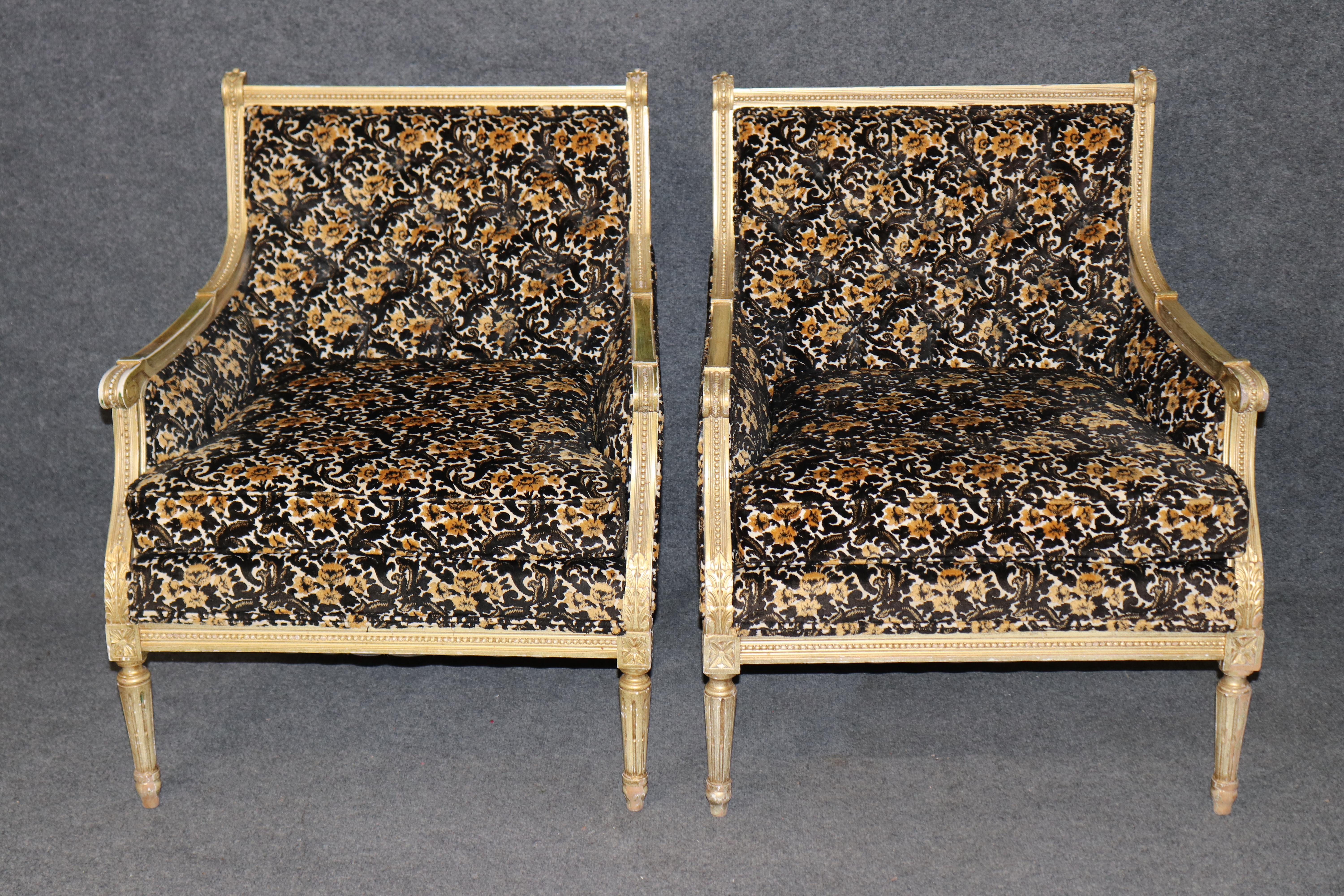 
Add a touch of regal French sophistication to your interior with this pair of gilded Louis XVI bergère chairs, exuding timeless neoclassical elegance. Expertly crafted, each chair features a finely carved giltwood frame with intricate rosettes,