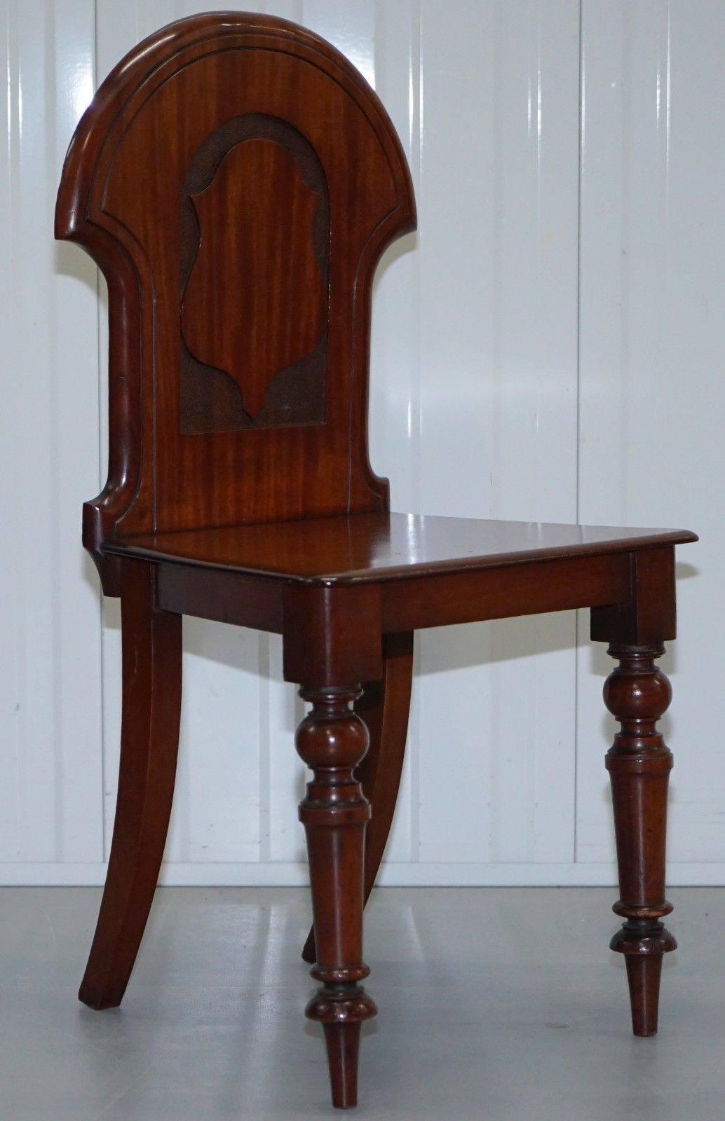 We are delighted to offer for sale this stunning pair of Regency mahogany shield back hall chairs, circa 1830

A very good looking and well-made pair with a nice vintage patina, we have cleaned waxed and polished them from top to