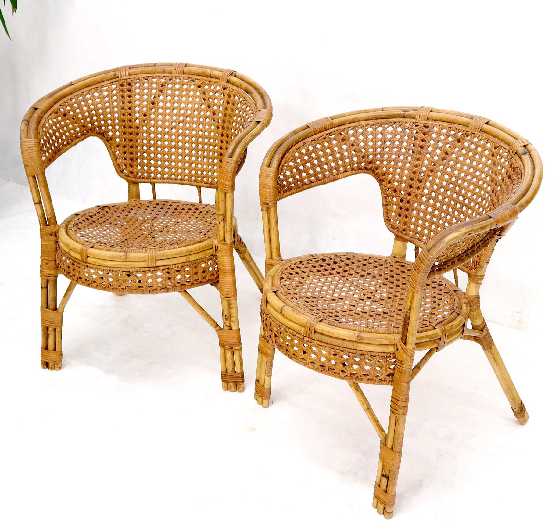 Pair of vintage rattan bamboo cane seat chairs.