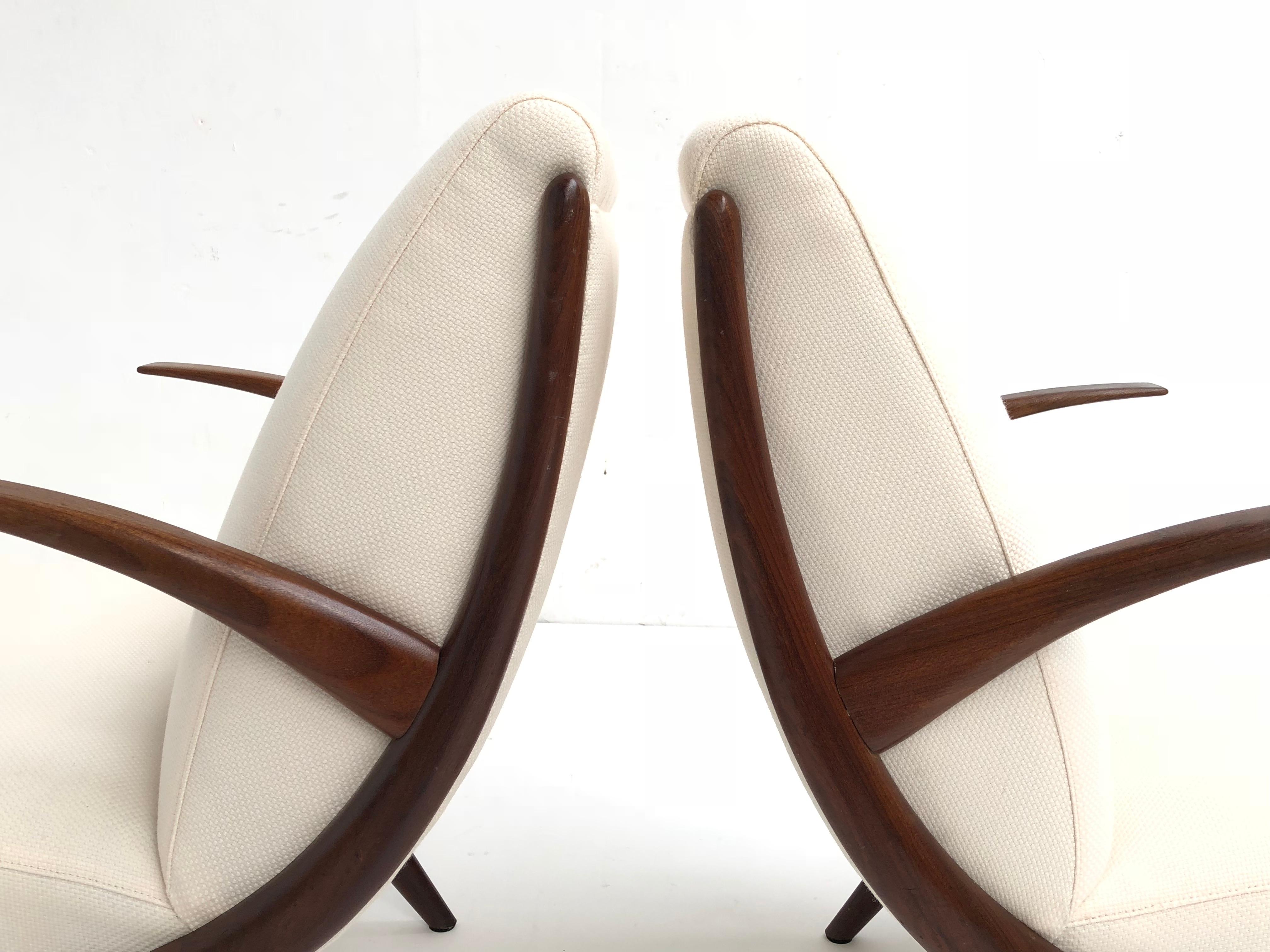 A stunning pair of Scandinavian teak armchairs from the late 1950s
Beautiful organic design in carved solid teak wood
This set has been newly upholstered with new Pantera Foam and a wool and linen De Ploeg fabric
An older restoration to one of