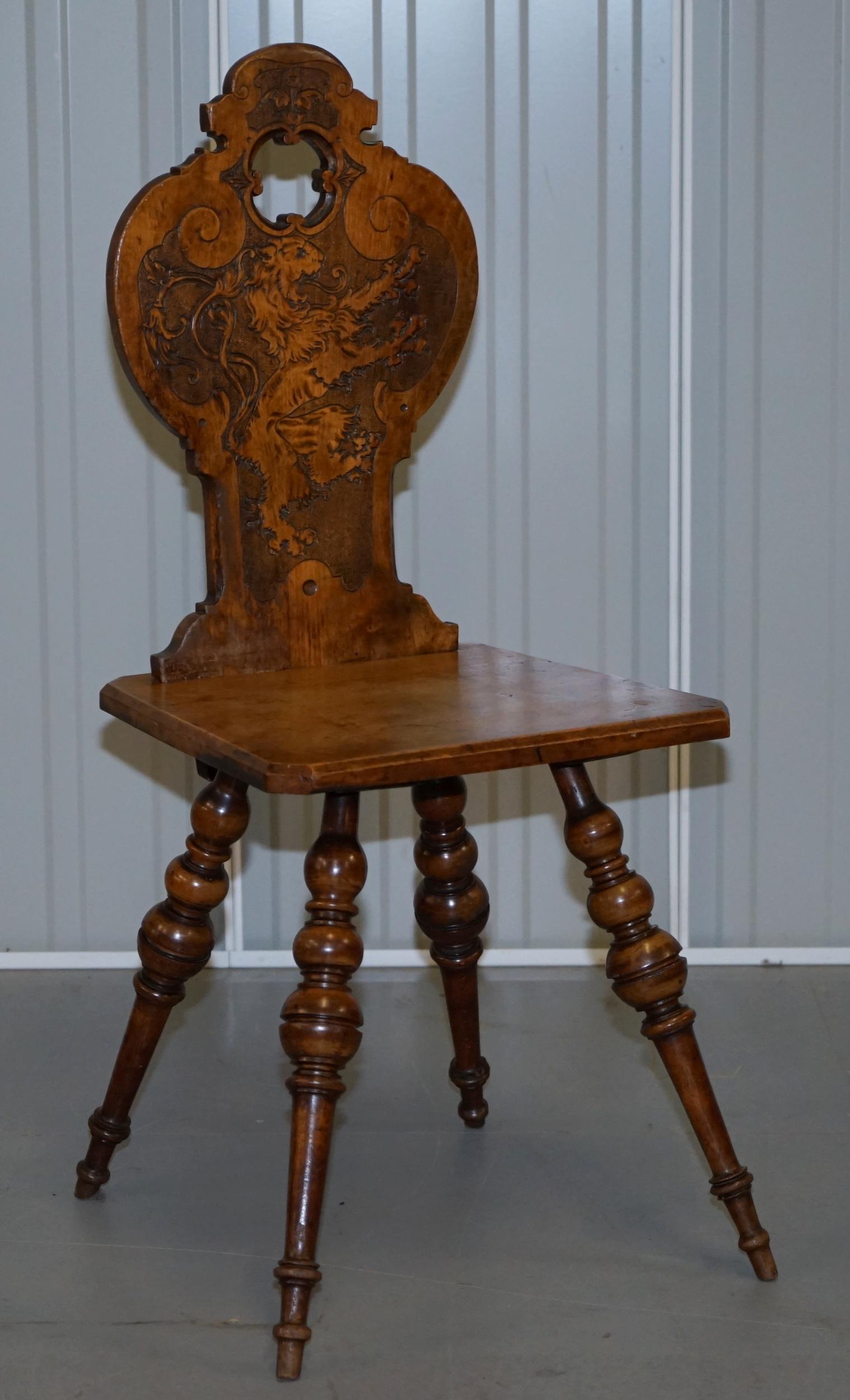 We are delighted to offer for sale this stunning pair of original Victorian Poker work hall chairs depicting Regency Armorial Crested Lions

A very good looking well made and decorative pair of chairs, they have some original finish left in the