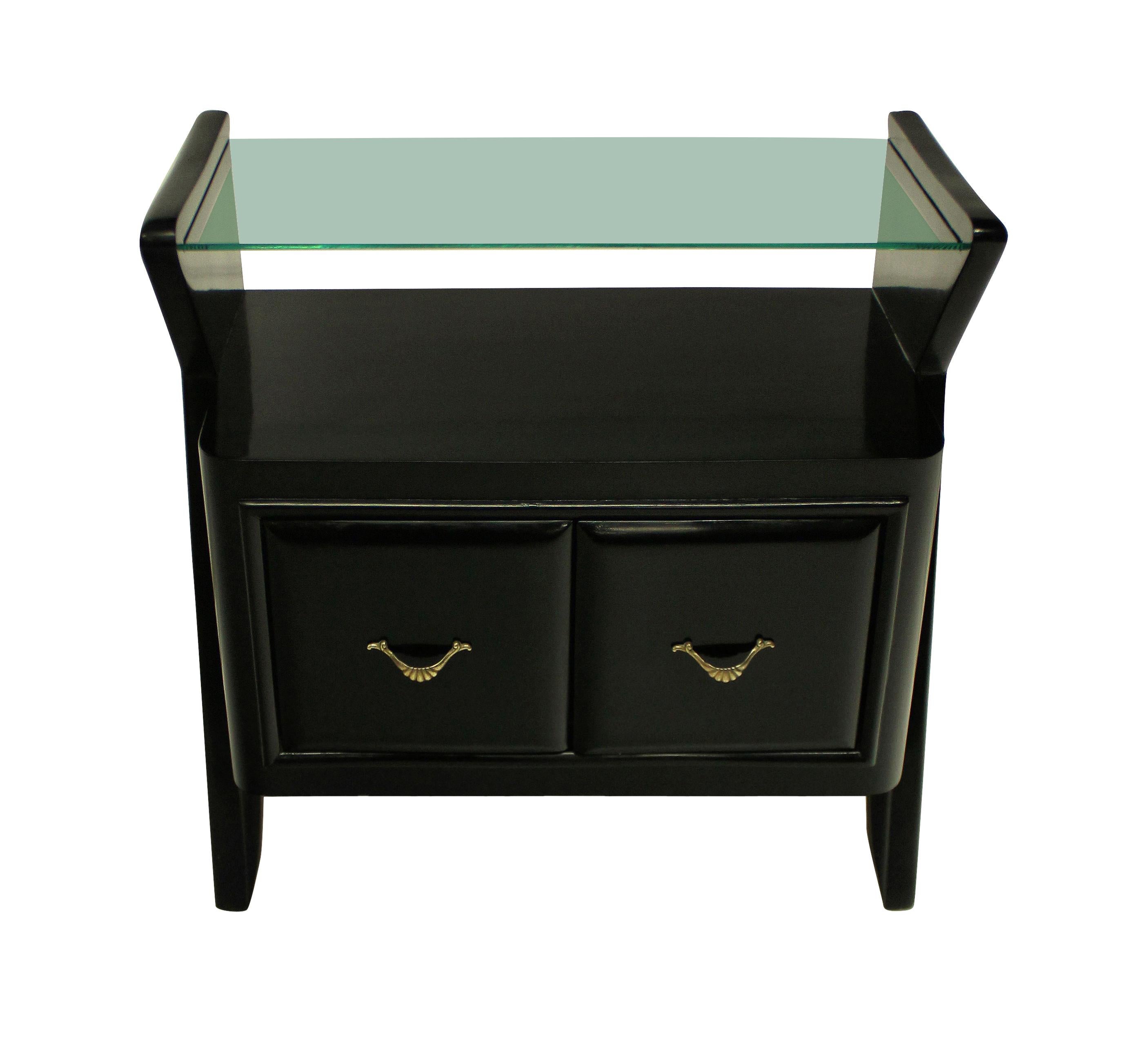 A pair of Italian ebonized nightstands of architectural design, with central cupboard, with glass shelves.