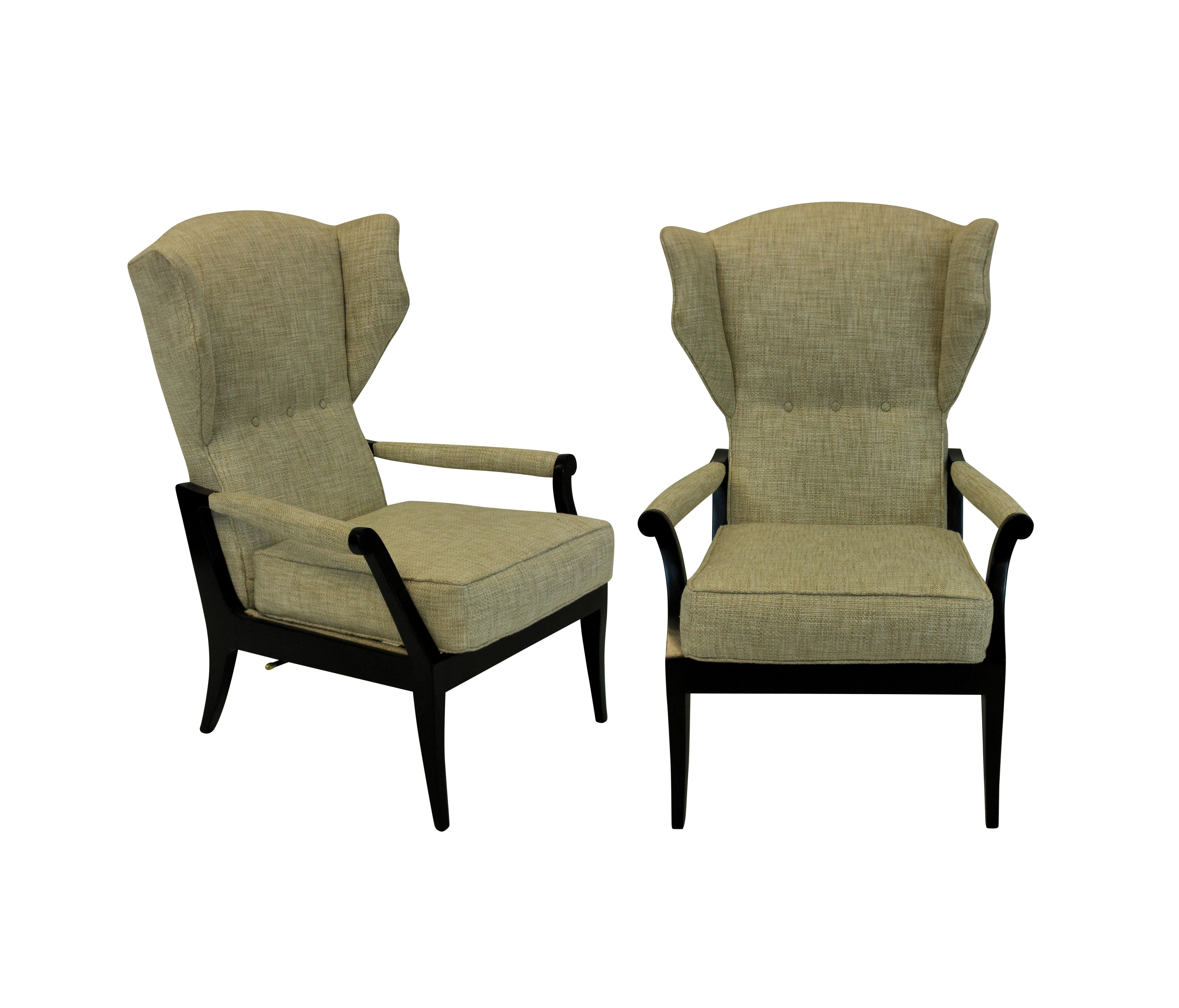 A pair of Italian reclining armchairs of stylish design. In ebonized wood and upholstered in oatmeal twill.

 