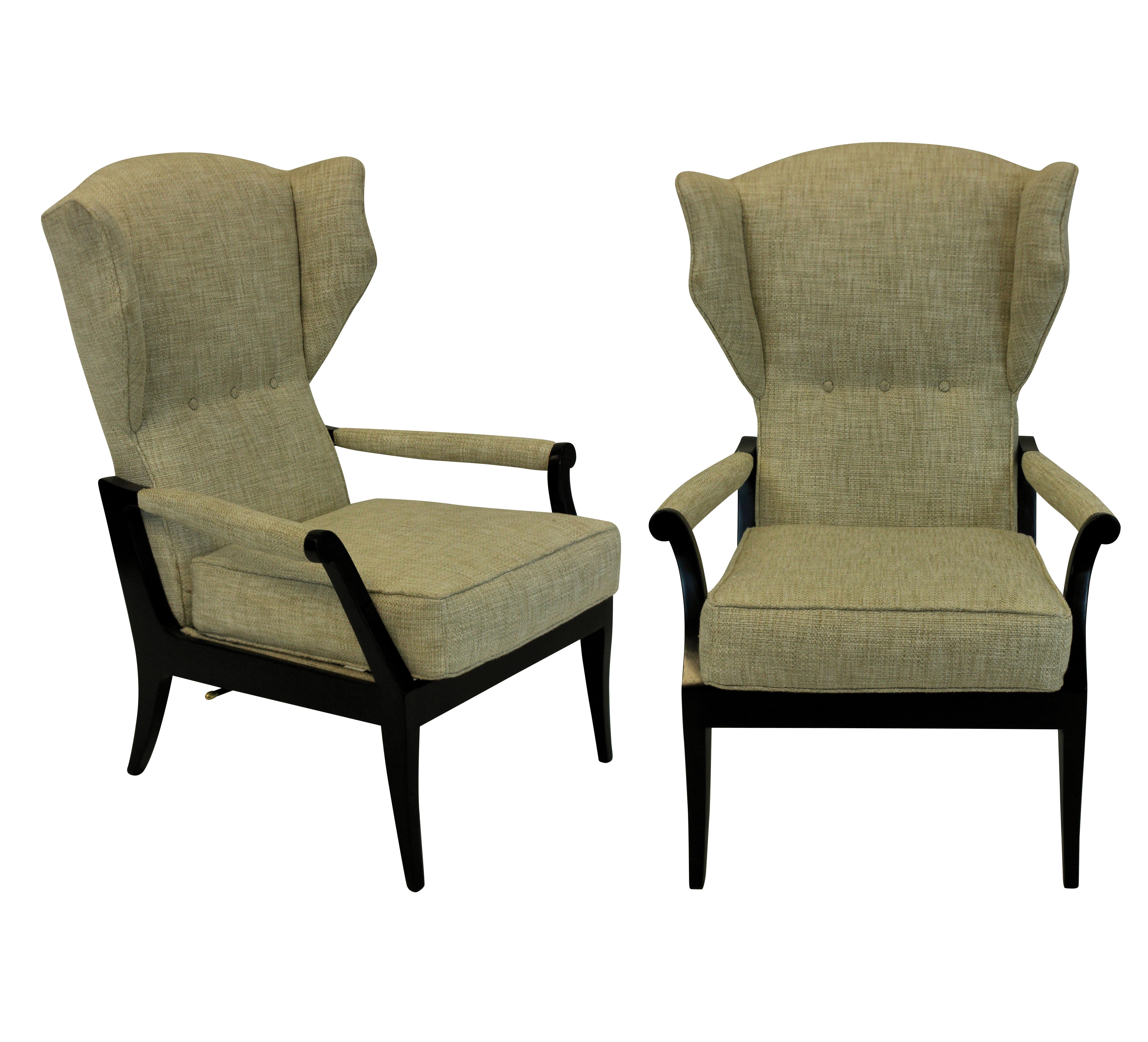 A pair of Italian reclining armchairs of stylish design. In ebonized wood and upholstered in oatmeal twill.
   
  